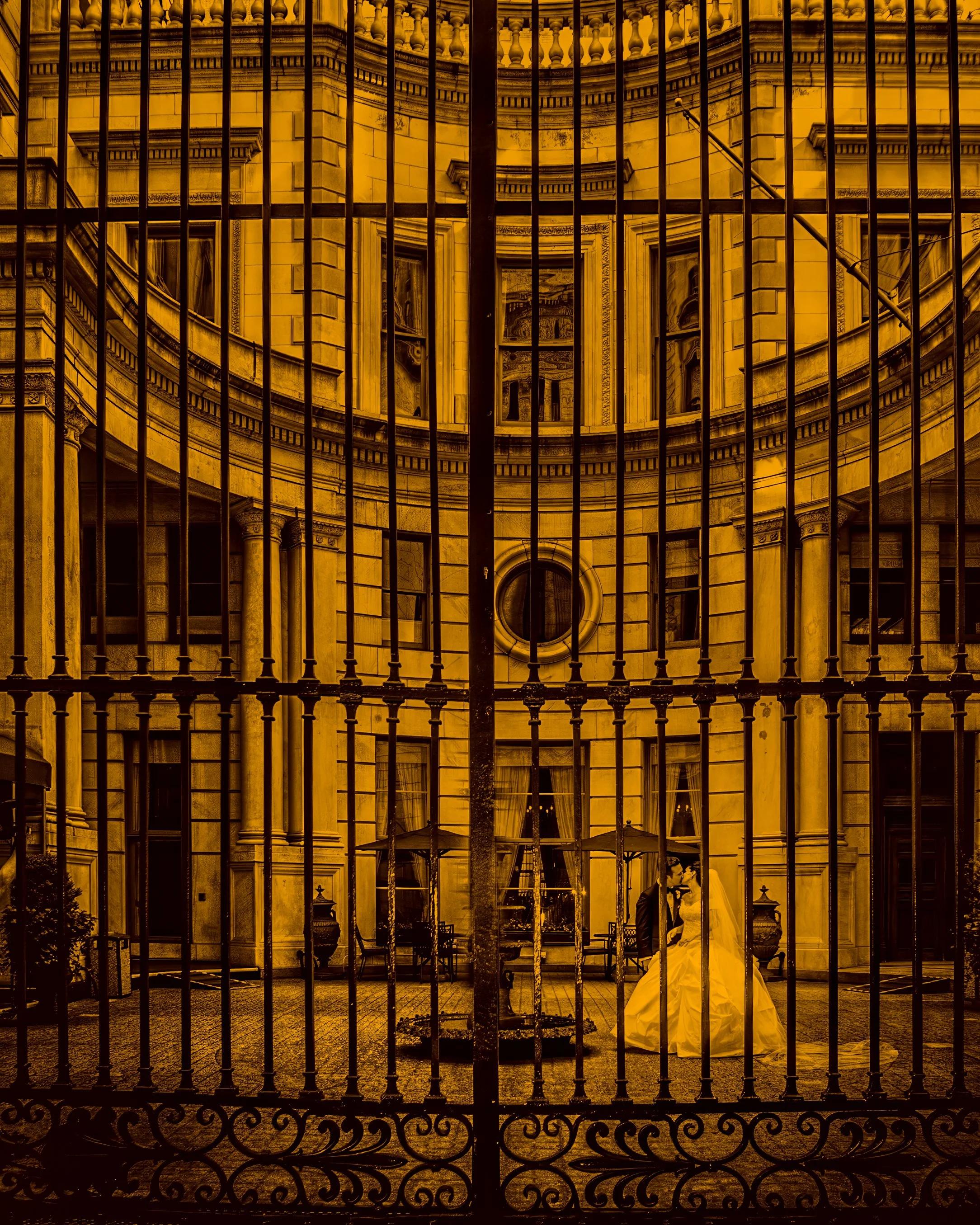 Bride and Groom Courtyard Portrait Through Gates at Metropolitan Club NYC