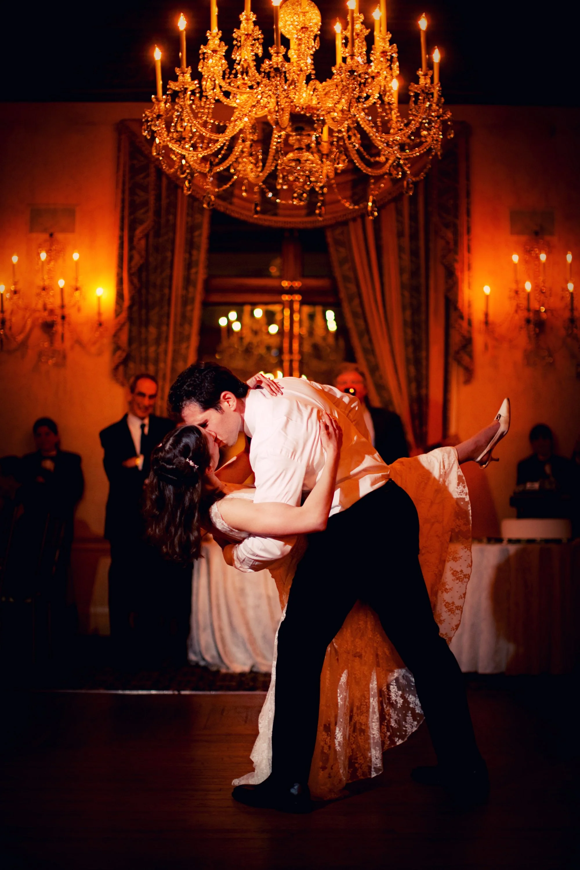 Groom dipping bride for a kiss on the dance floor at the Harmonie Club NYC