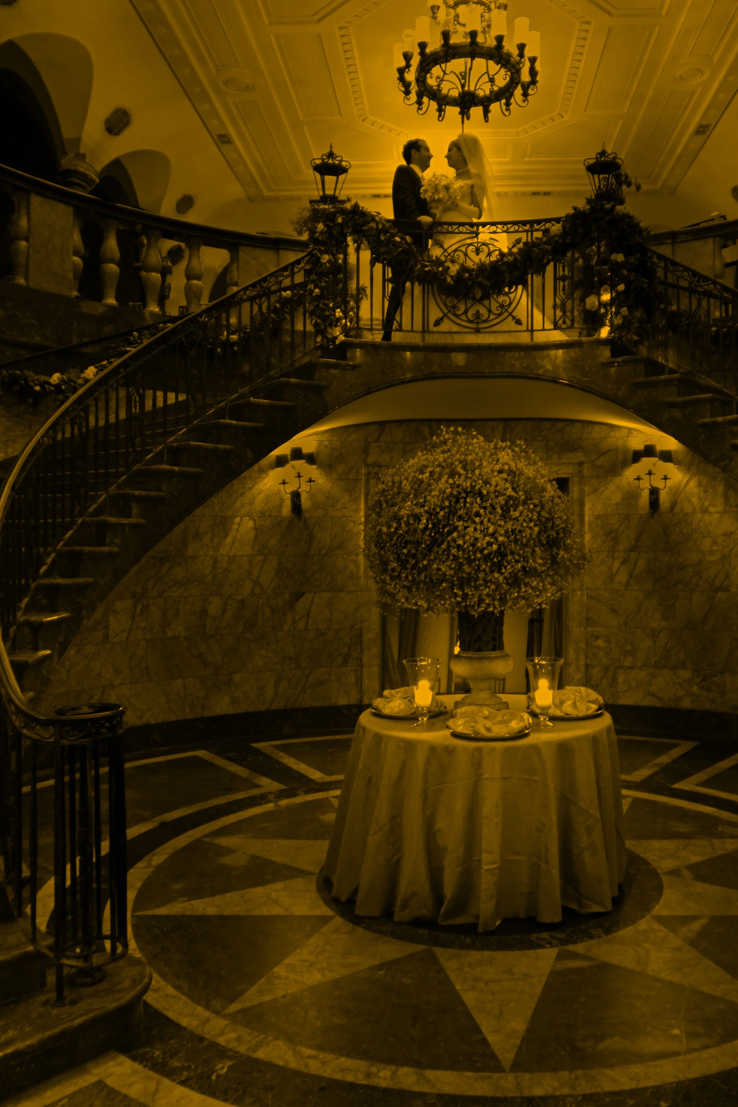 Fine art split tone silhouette of bride and groom on 48 Wall Street grand staircase NYC.
