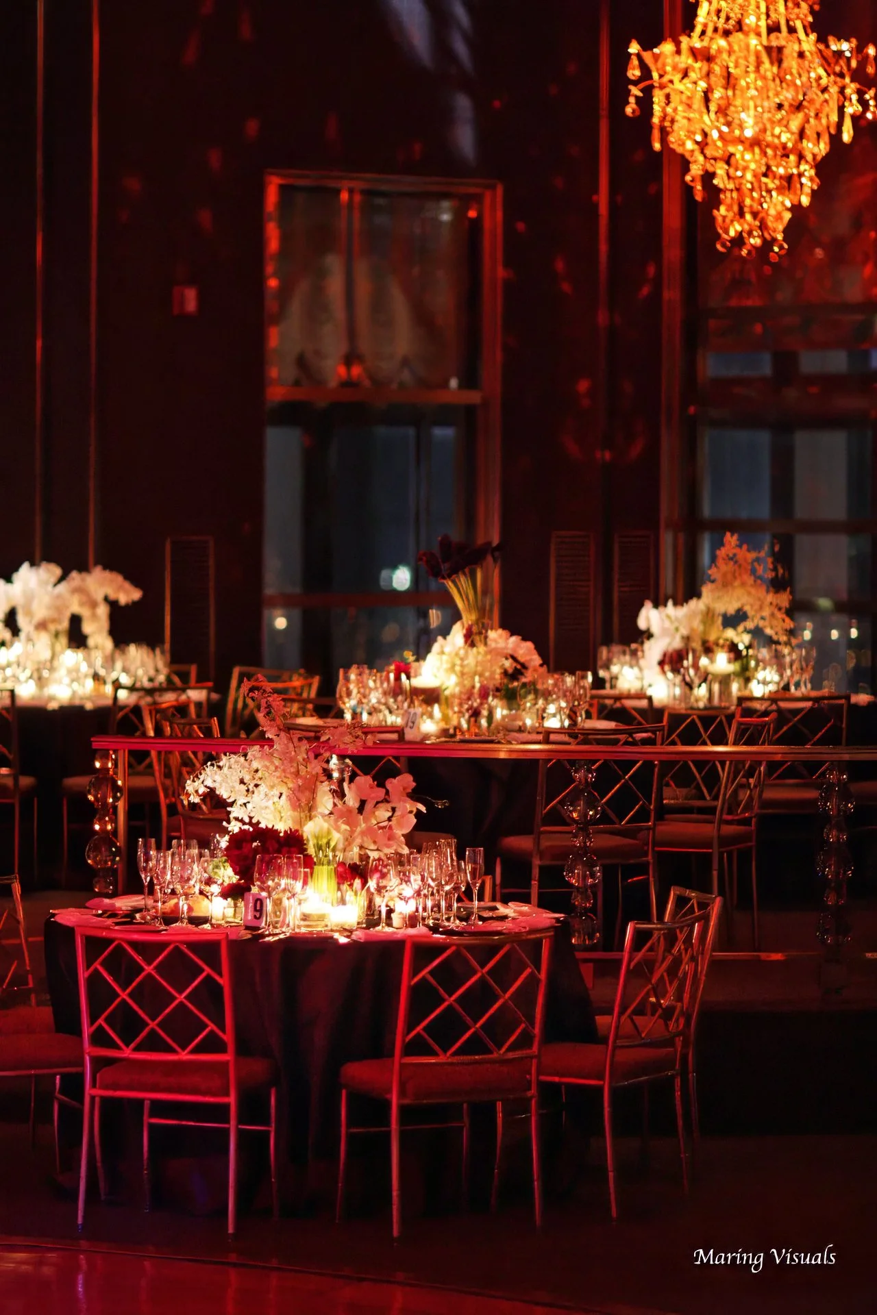Elegant floral centerpieces complement the Art Deco charm of the Rainbow Room wedding ballroom in New York City.
