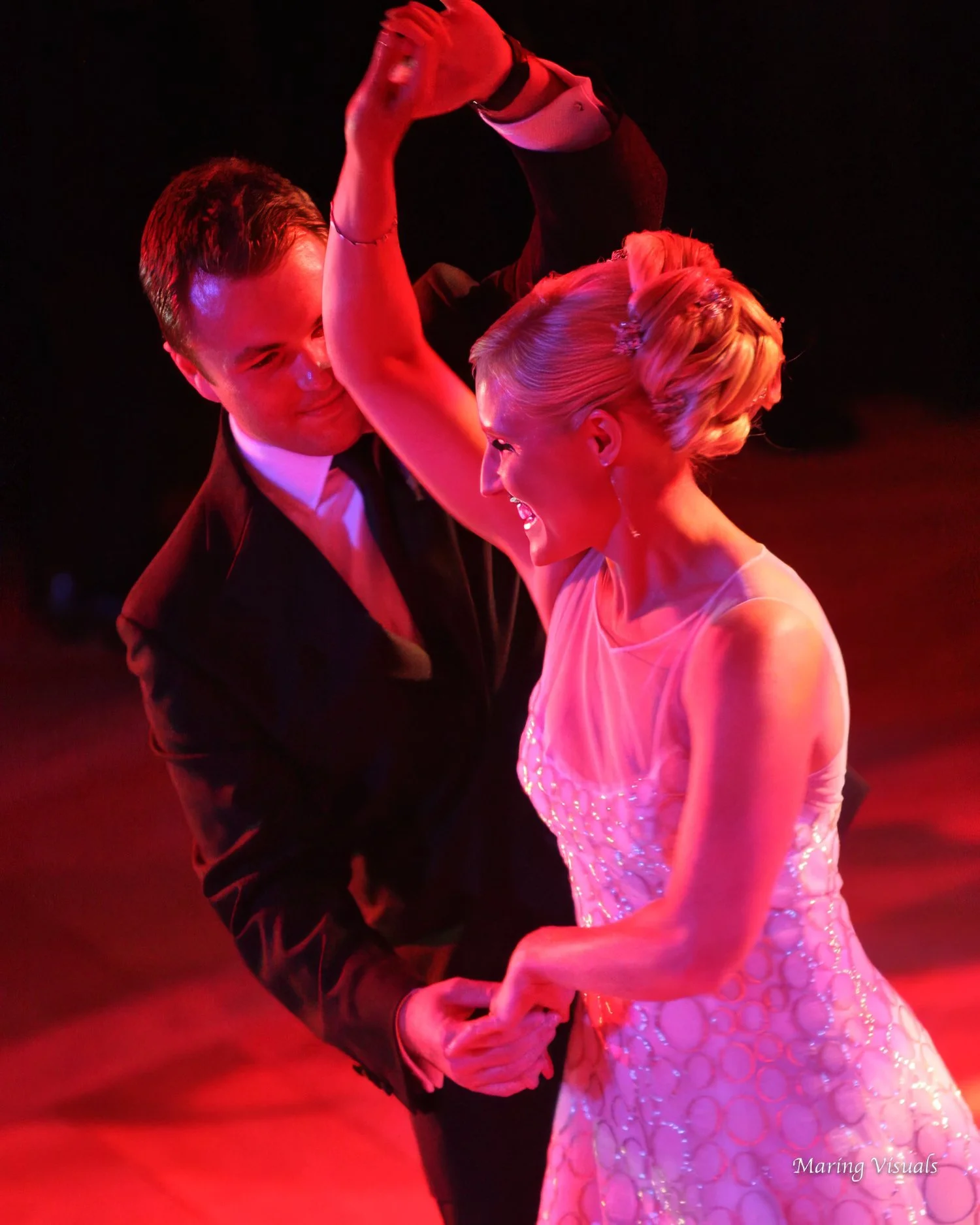 Bride and Groom Dancing in Red Lighting at Rainbow Room