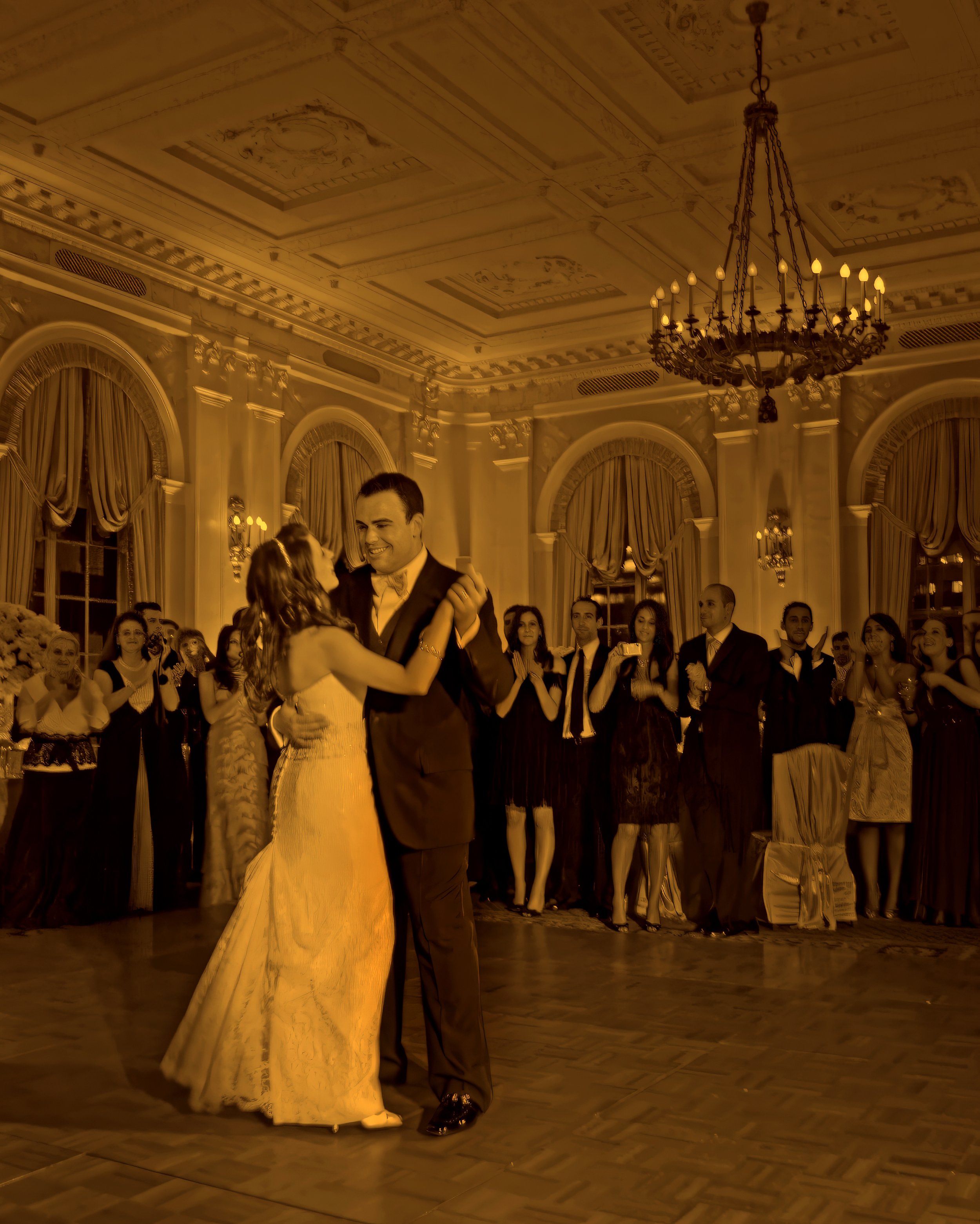 Bride and groom share their first dance at a wedding reception in the Yale Club NYC ballroom.