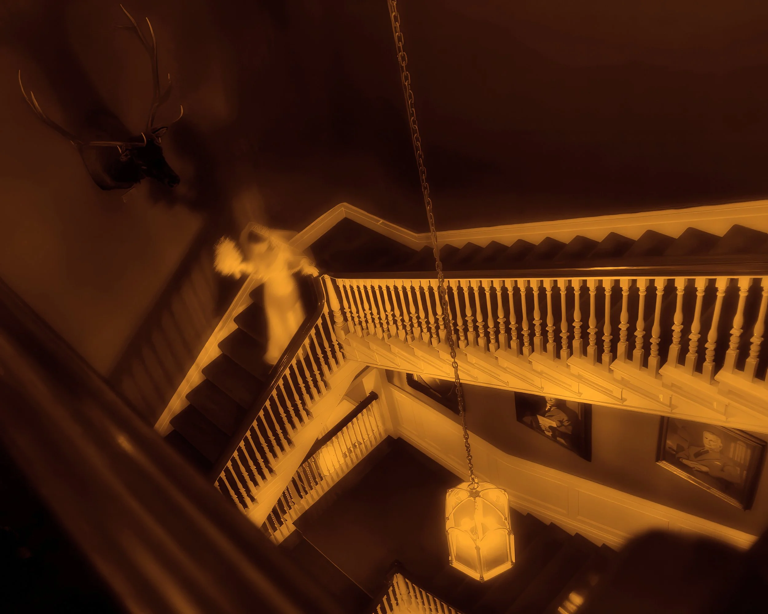 Ethereal image of the bride descending the grand staircase at the Harvard Club NYC.