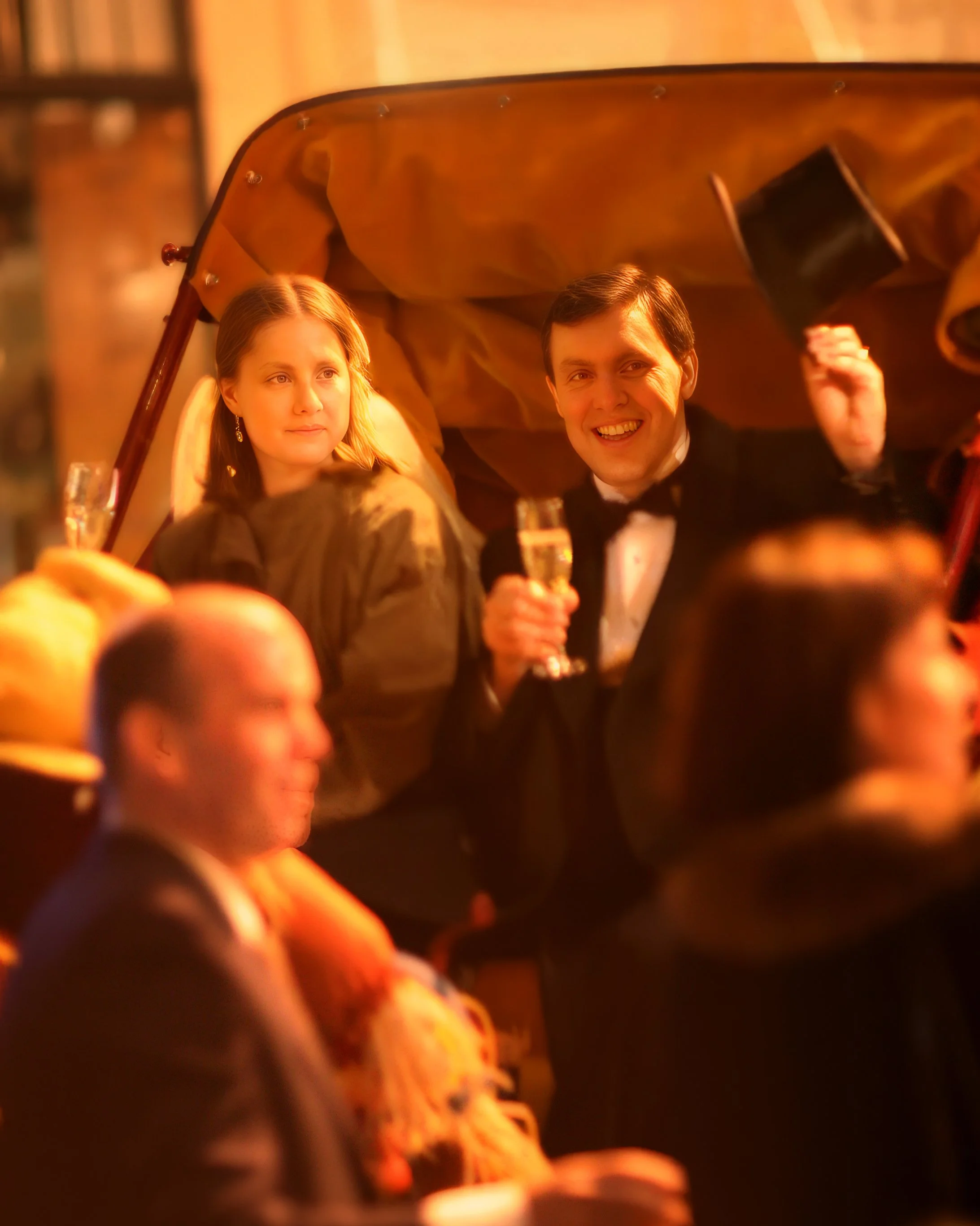 Bride and groom toast as they leave the Harvard Club NYC in a horse-drawn carriage.