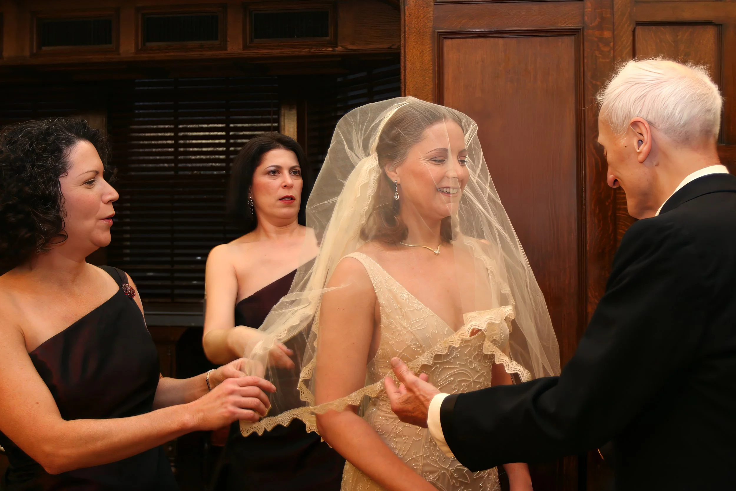 Father Lowers Bride’s Veil