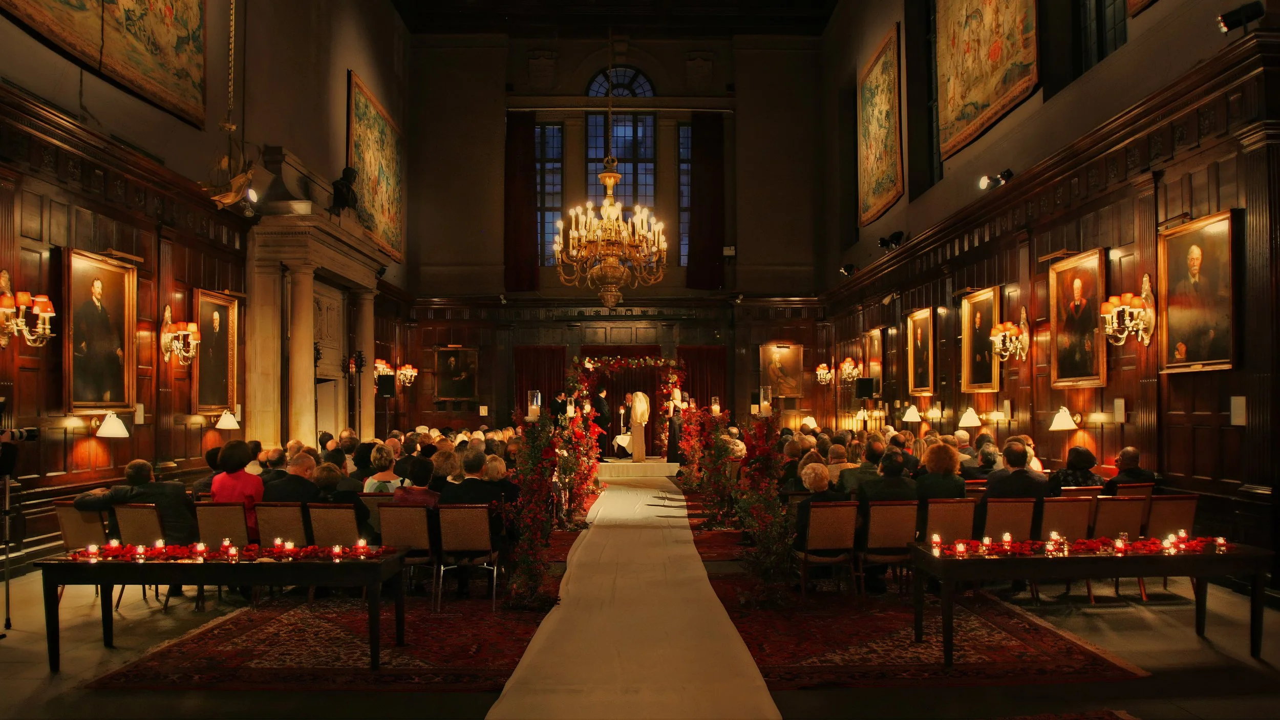Bride and groom exchange vows in Harvard Hall during their wedding ceremony at the Harvard Club NYC.