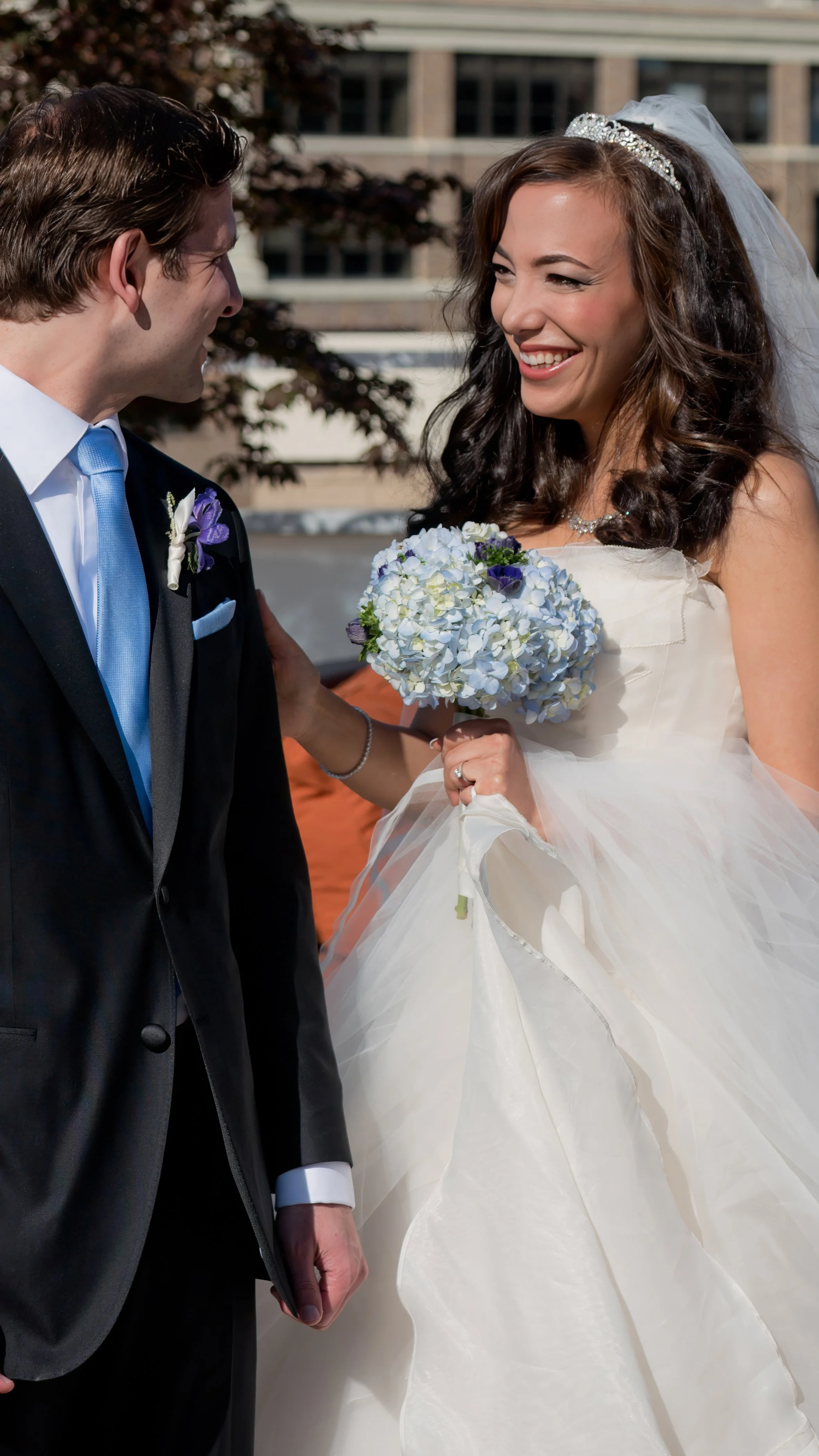 Bride and groom sharing a first look on the rooftop terrace at Tribeca Rooftop in Manhattan