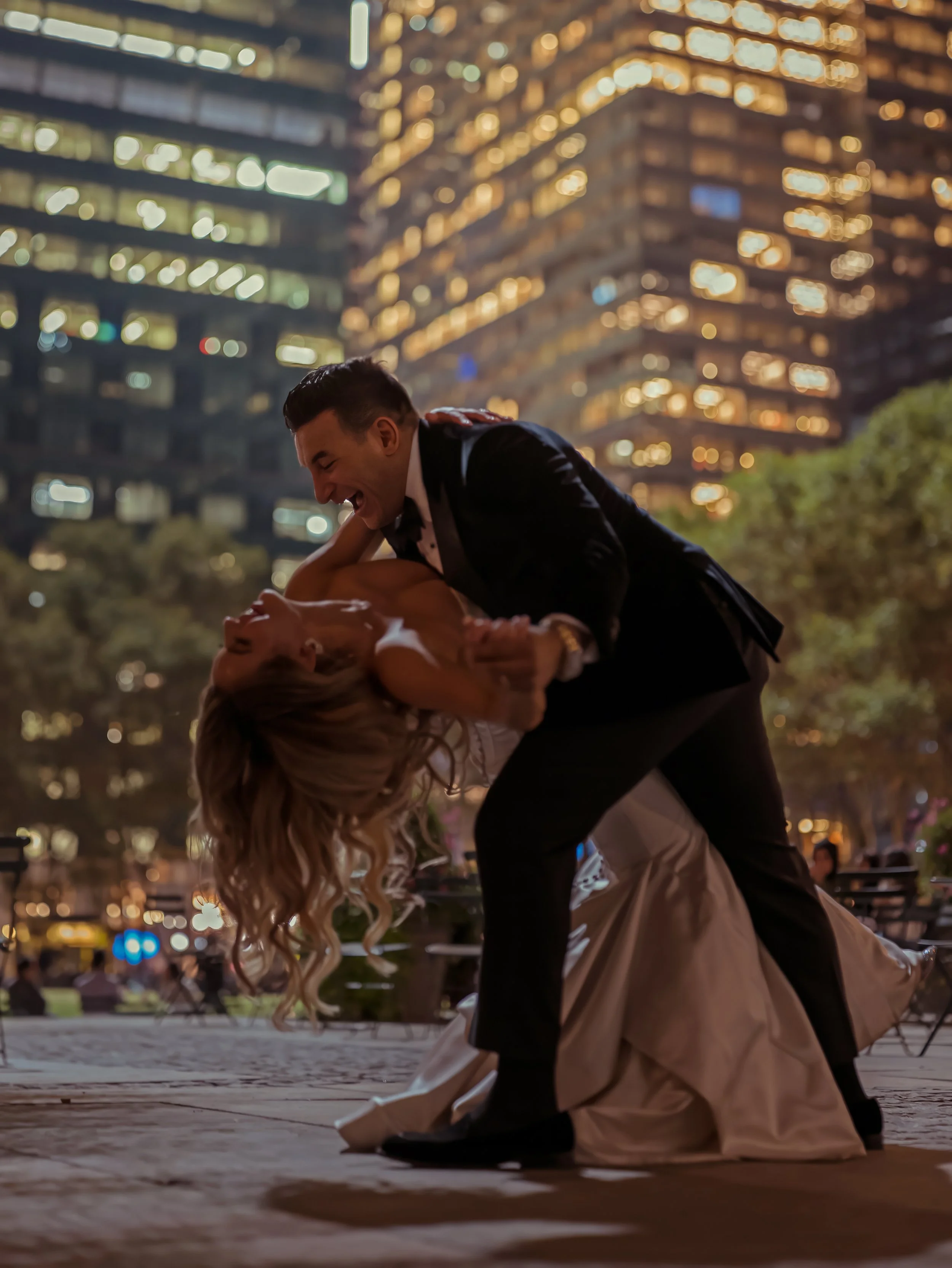 Bride Dips Groom in Bryant Park Night Wedding Portrait NYC