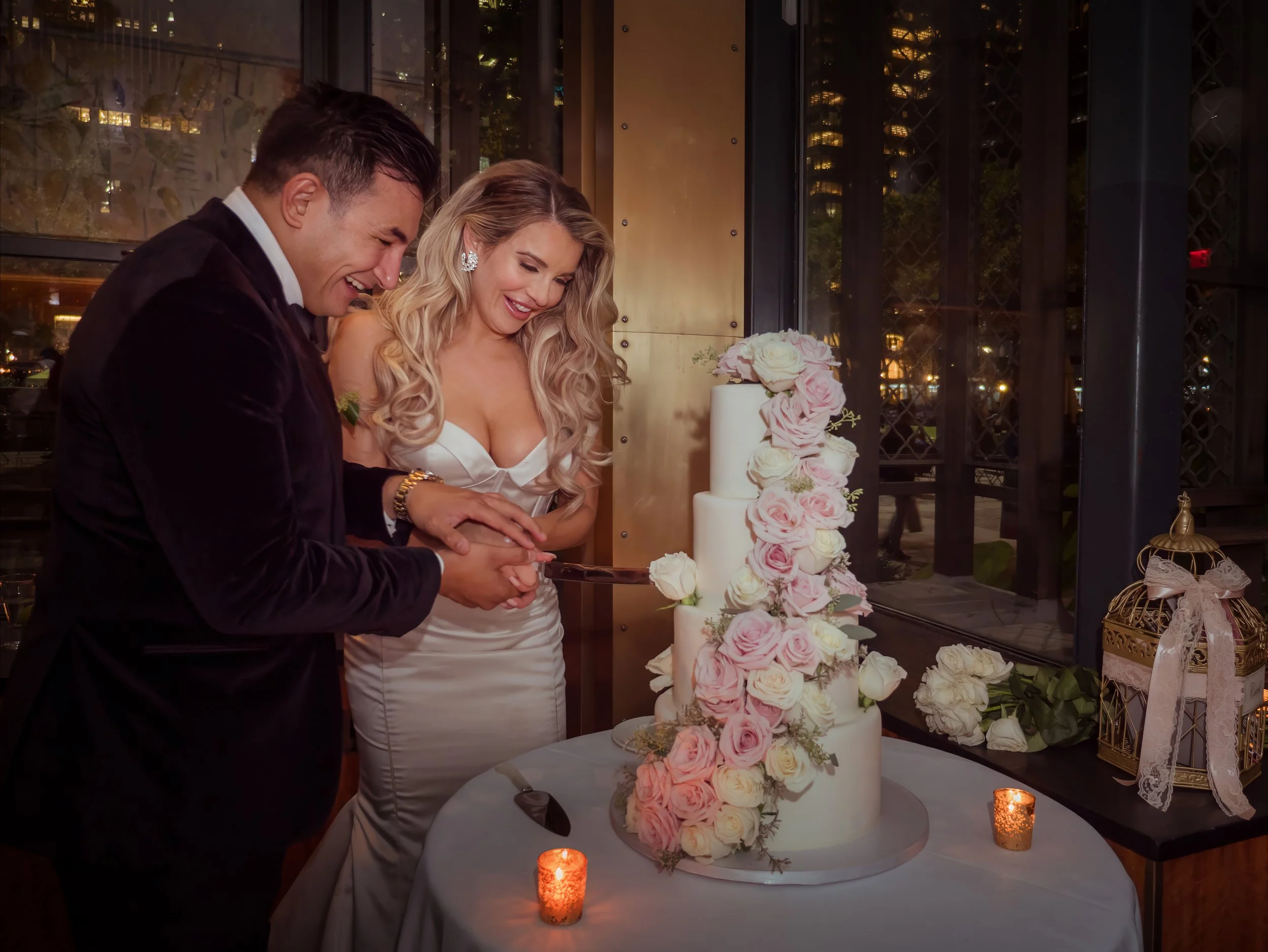 Bride and groom cutting wedding cake at Bryant Park Grill reception Midtown Manhattan wedding