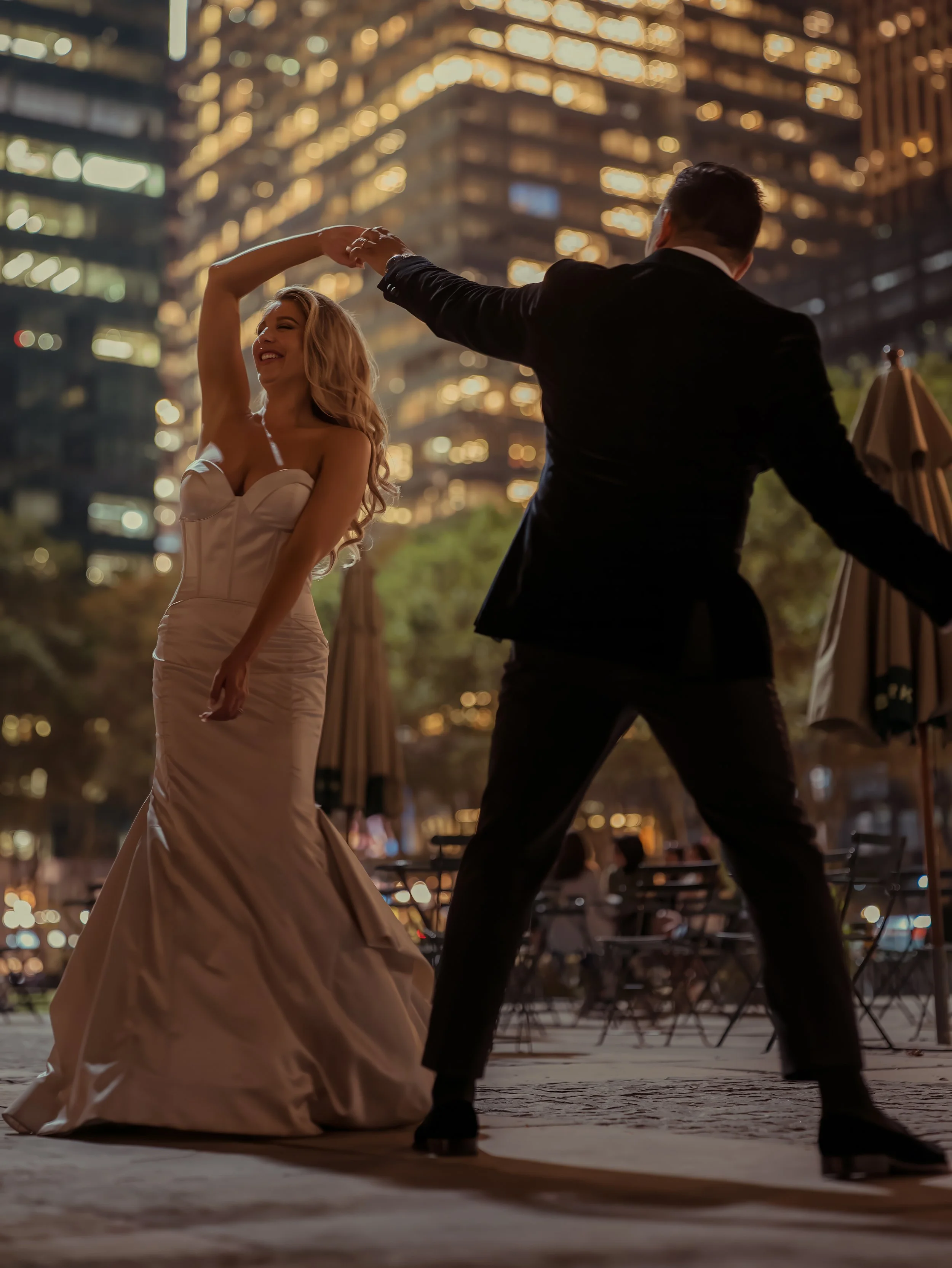 Bride and Groom Dancing in Bryant Park at Night NYC Wedding