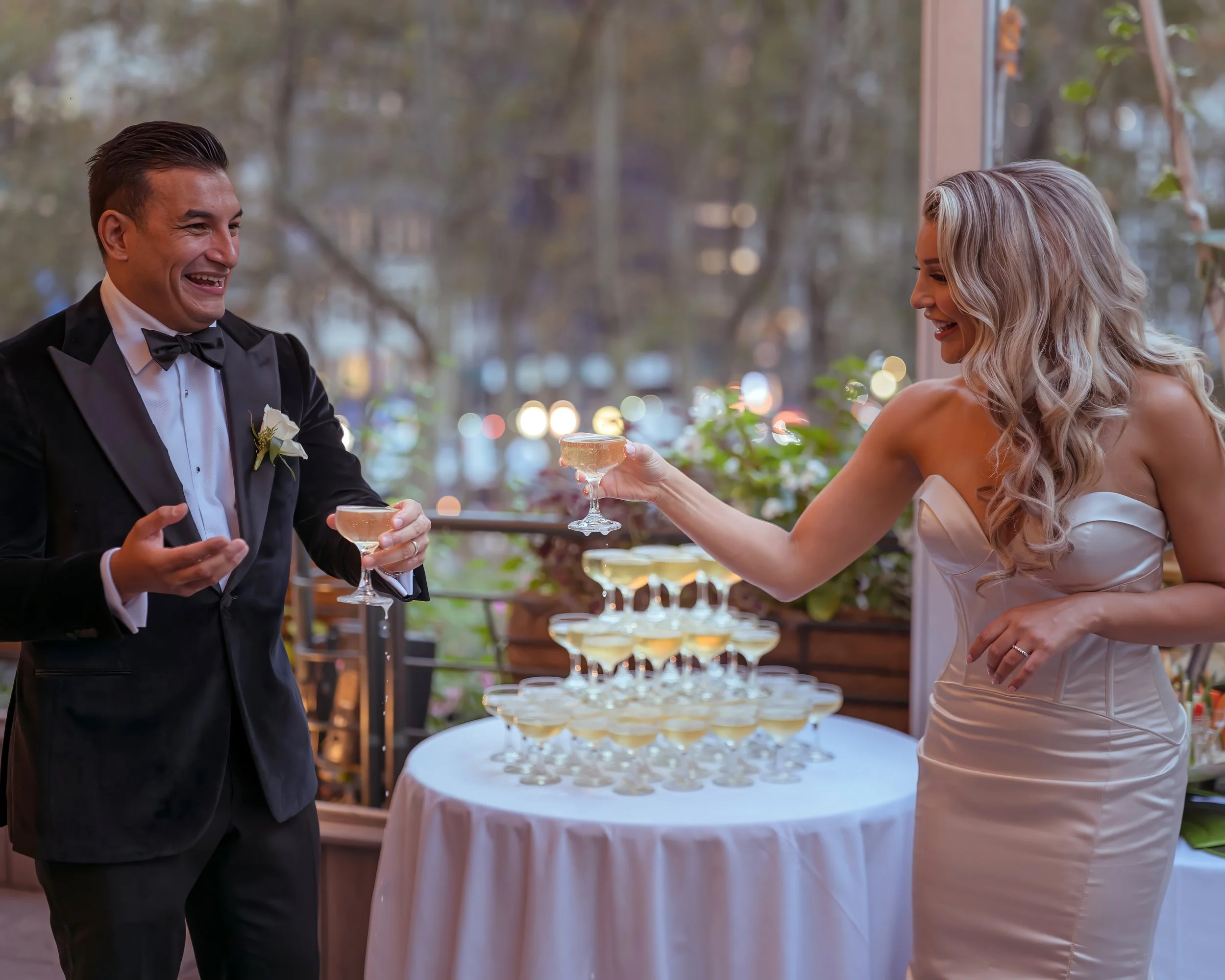 Bride and groom champagne toast on Bryant Park Grill terrace after wedding ceremony Midtown Manhattan