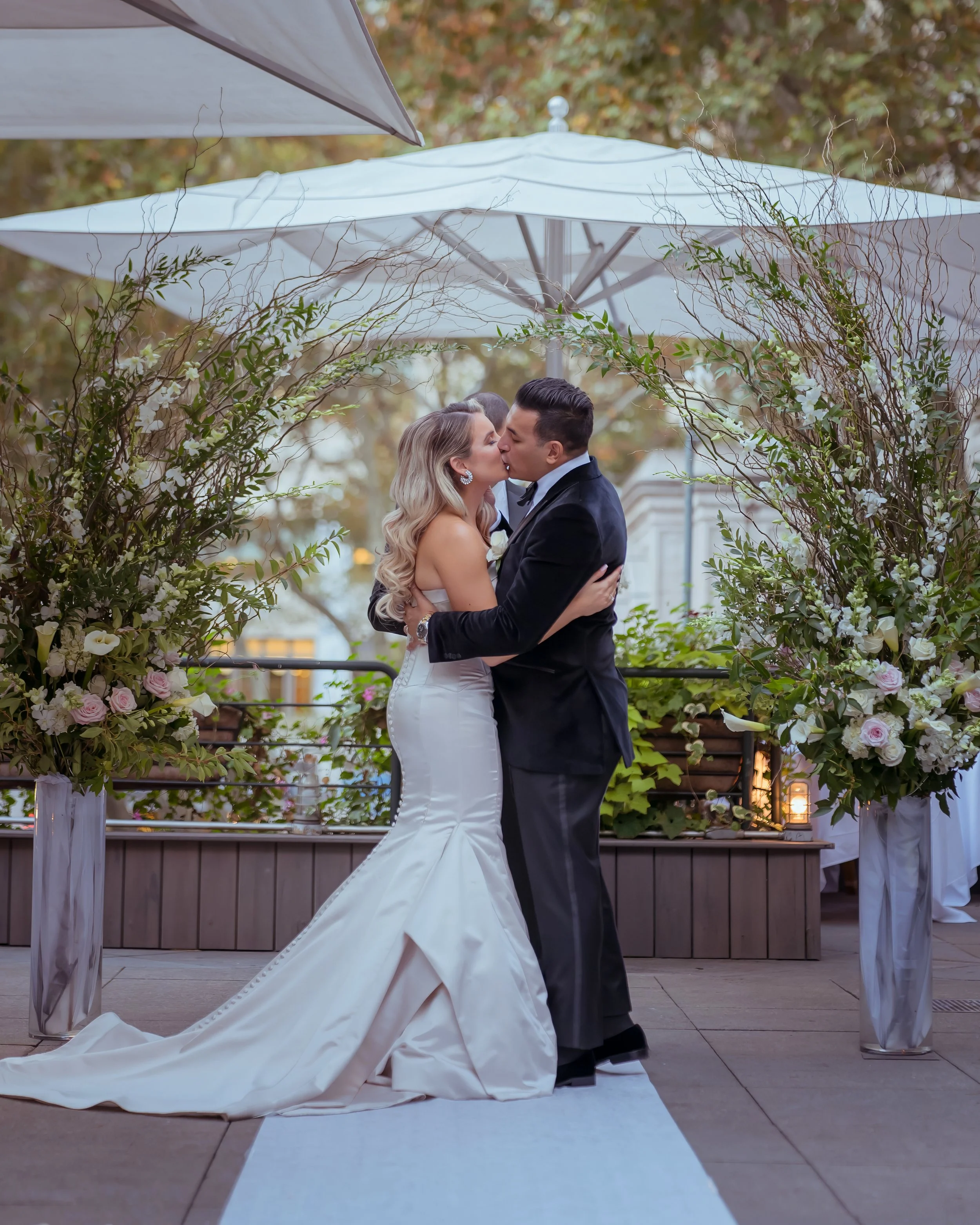 First Kiss as Husband and Wife Bryant Park Grill Terrace Wedding NYC