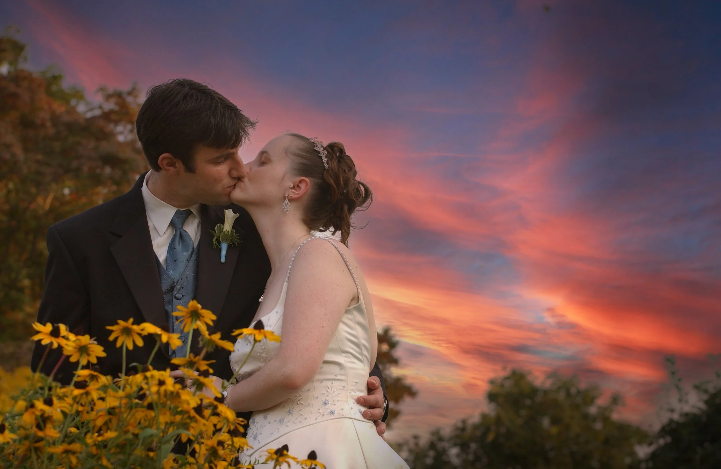 Sunset Kiss Among Flowers Inn at Mystic Wedding