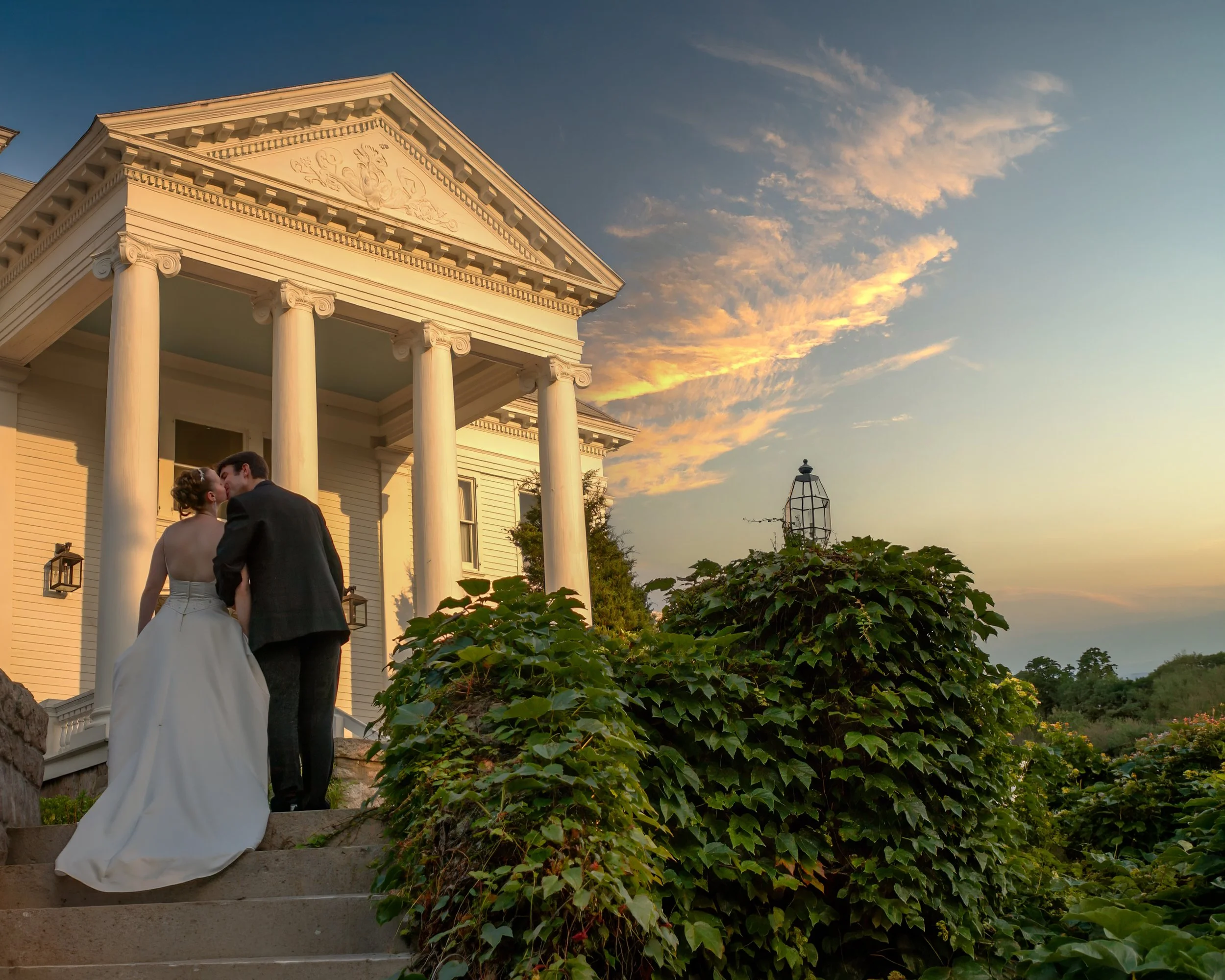 Couple Ascending Steps to Haley Mansion Inn at Mystic