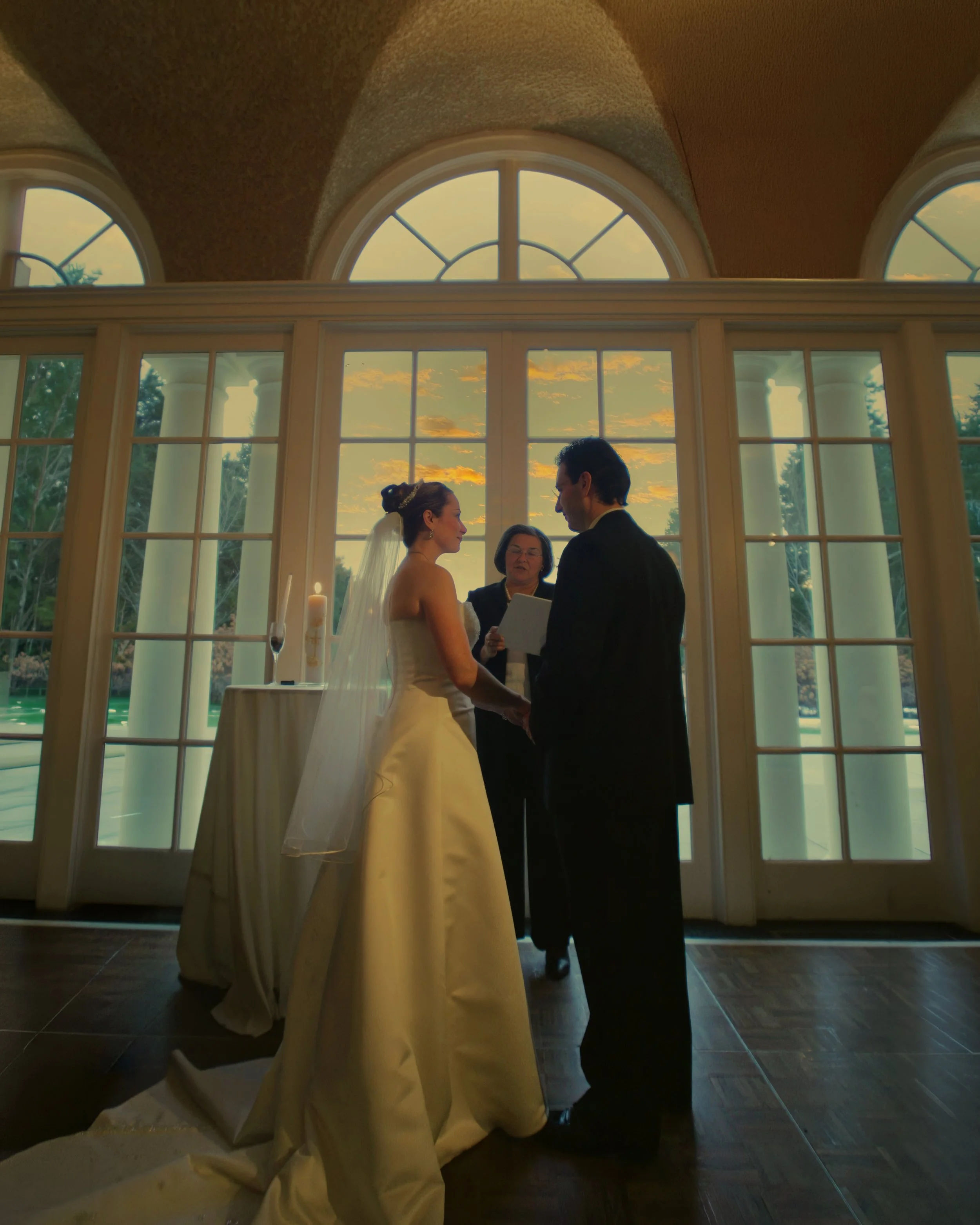 Wedding ceremony inside Wadsworth Mansion showcasing historic architectural interior details and elegant lighting