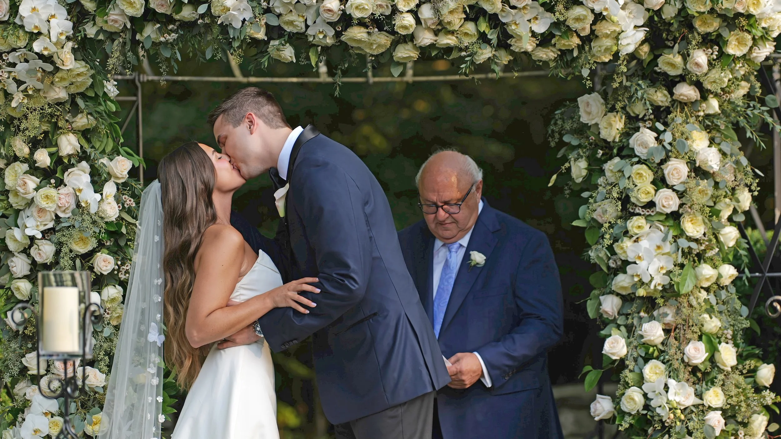 Close-Up First Kiss in Side Garden Ceremony