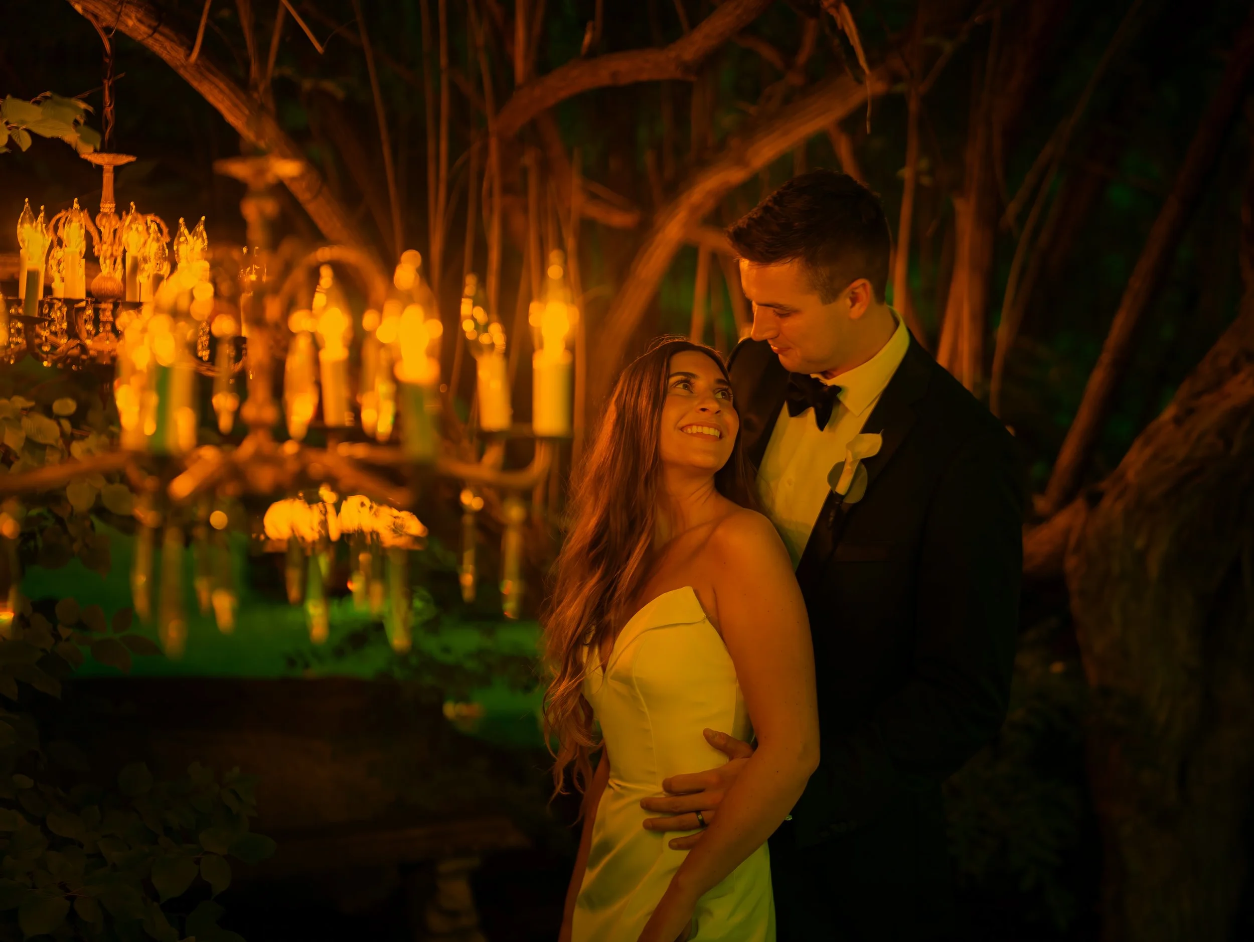 Romantic bride and groom portrait in chandelier lights at Lord Thompson Manor wedding in Connecticut