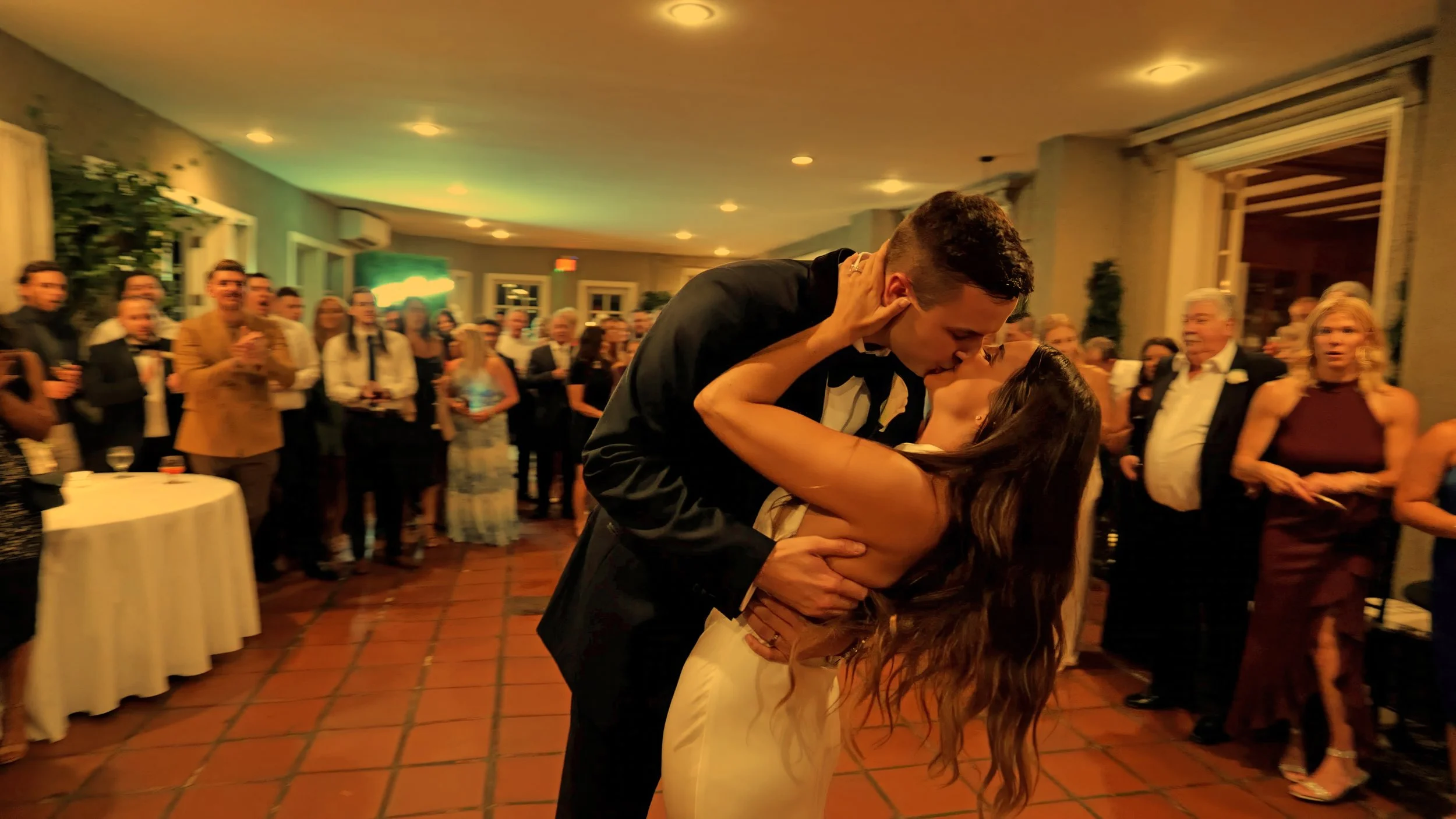 Groom dips bride for kiss during first dance at Lord Thompson Manor wedding
