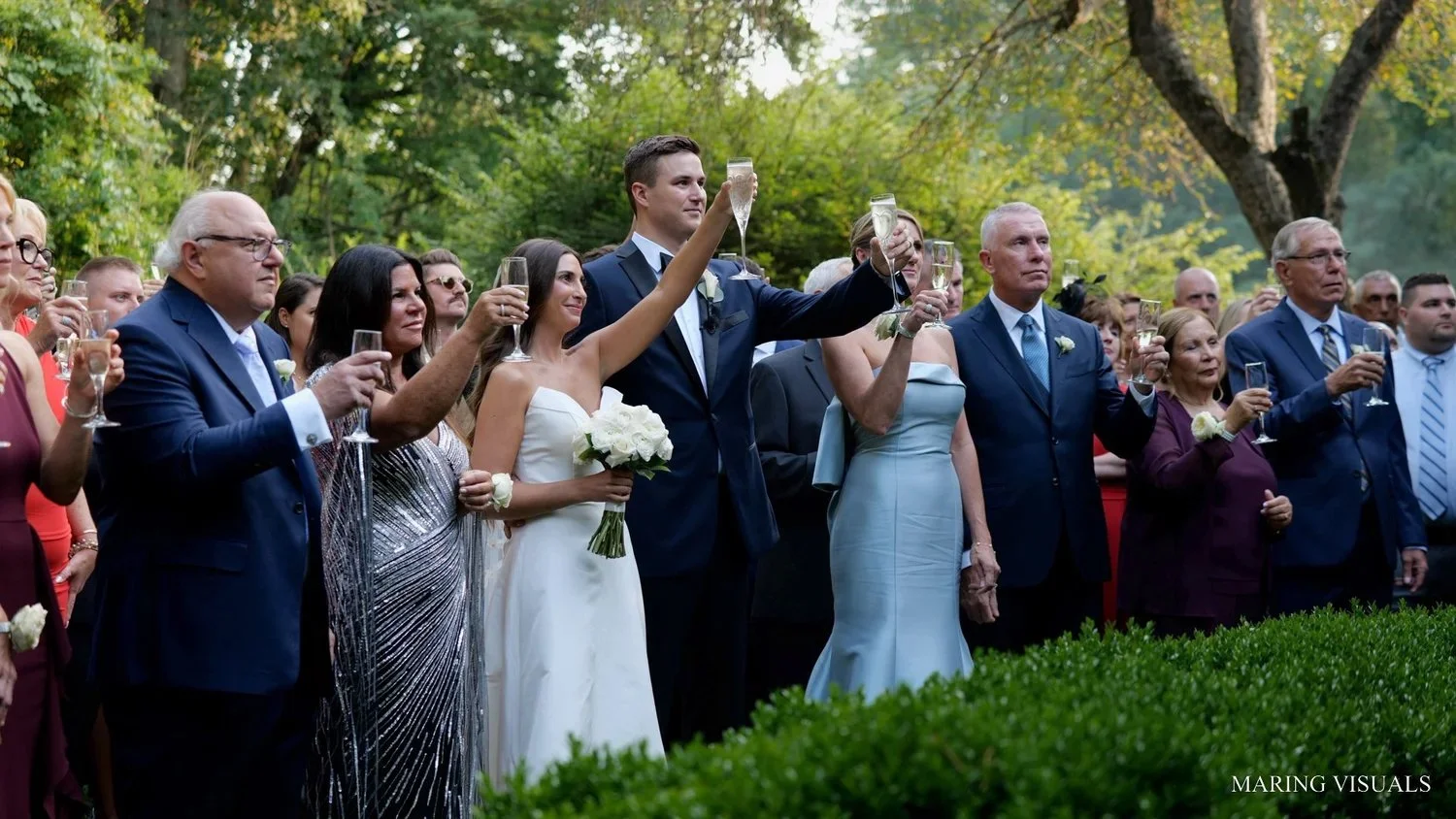 Guest Toasts in Side Garden at Lord Thompson Manor
