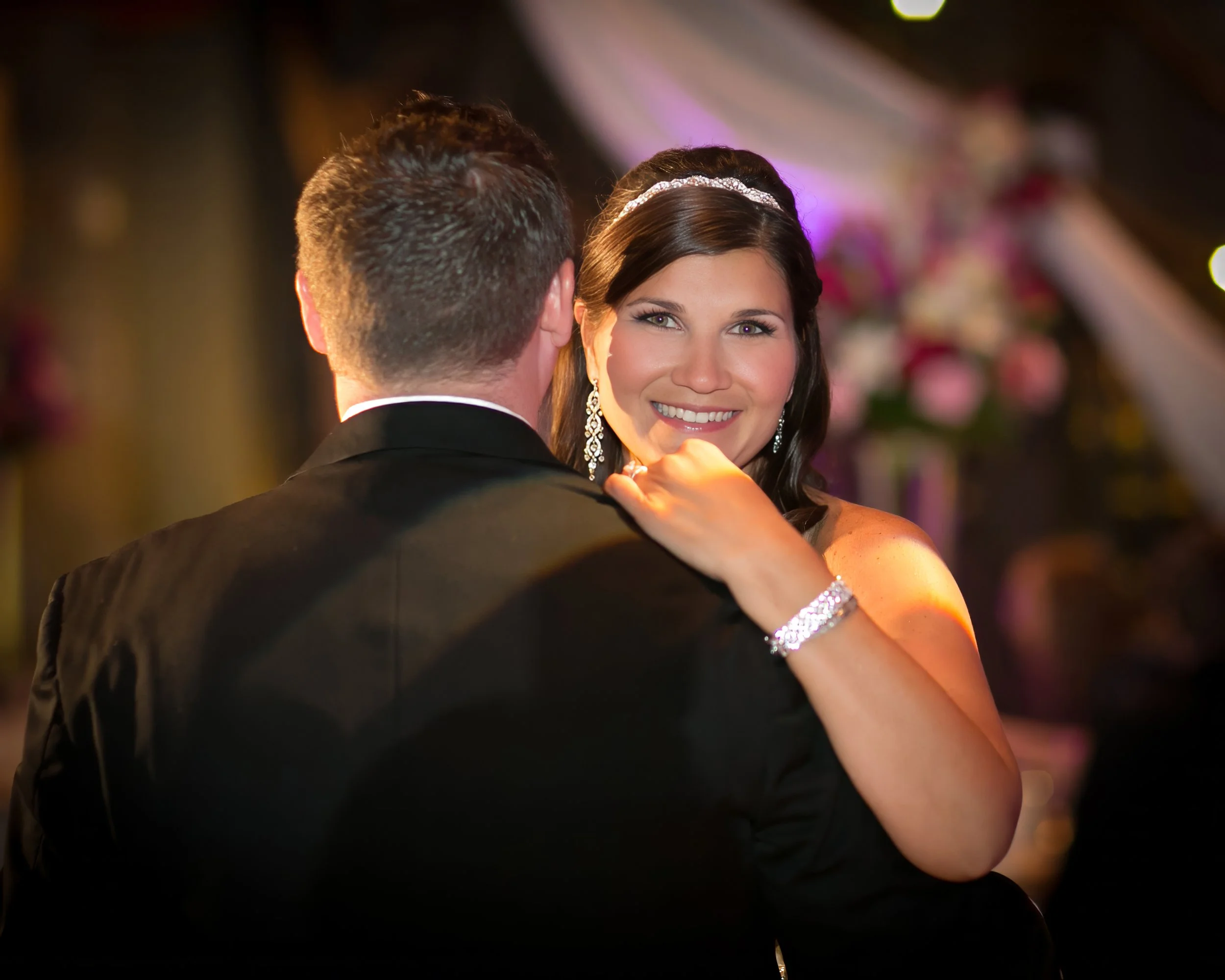 Closeup of bride smiling during first dance at The Society Room of Hartford wedding reception