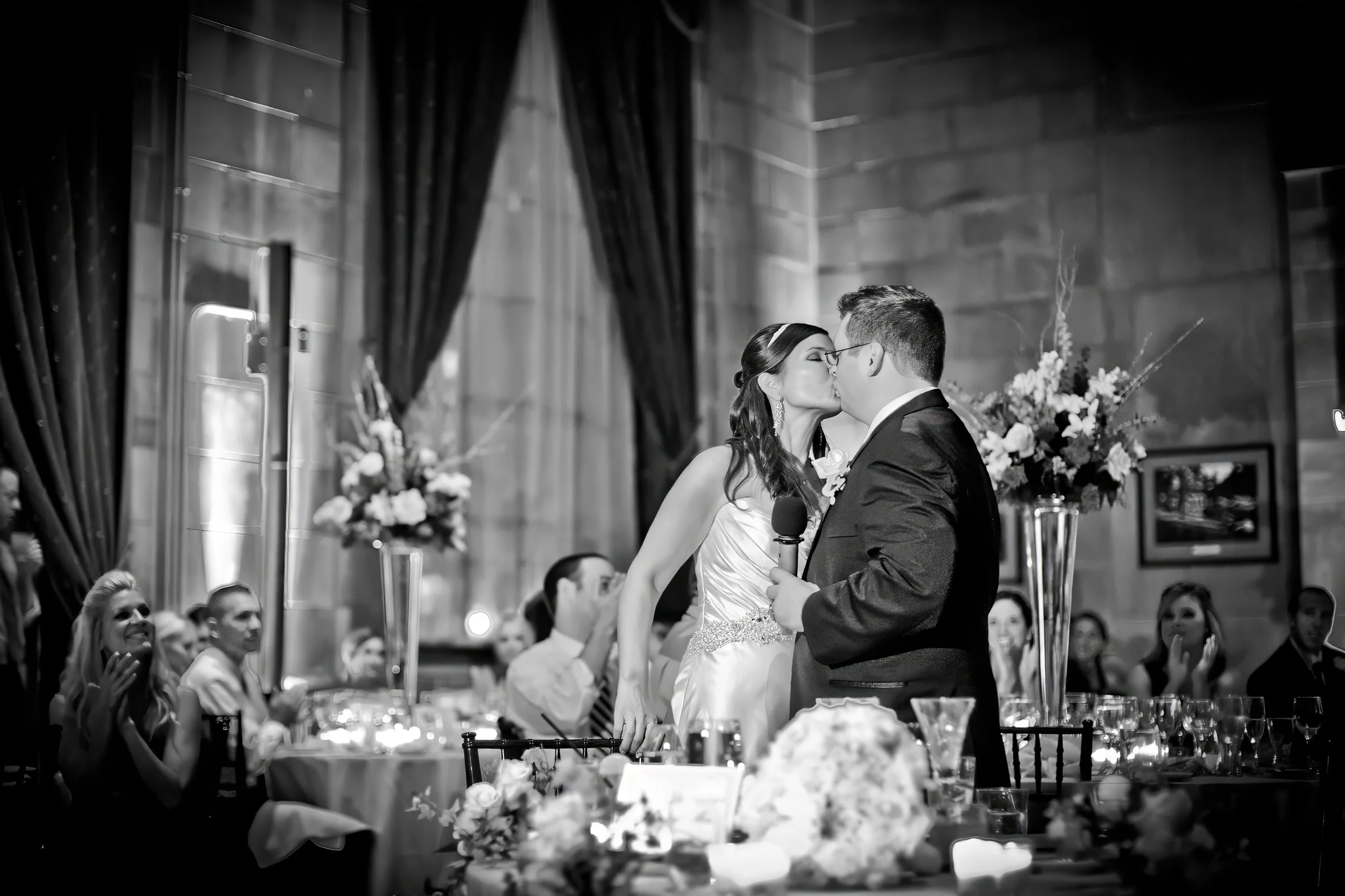Bride and groom kissing during wedding reception at The Society Room of Hartford