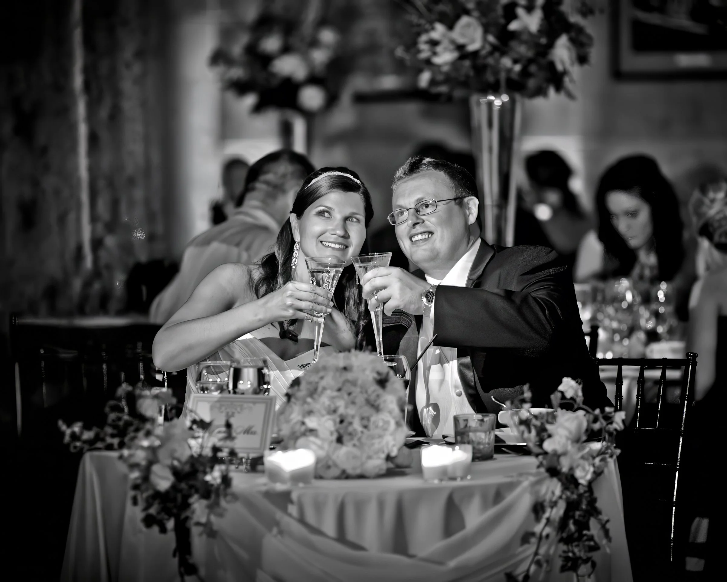 Black and white photo of bride and groom toasting at The Society Room of Hartford wedding