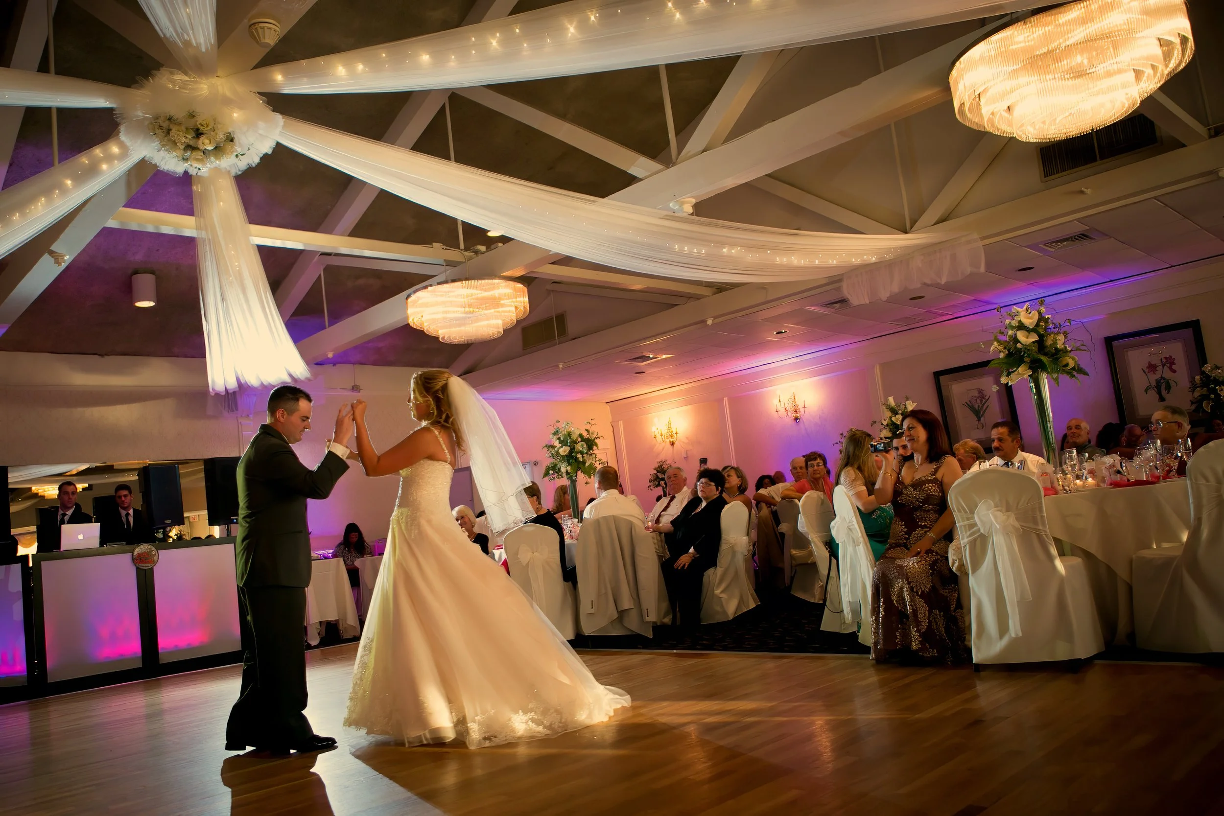 Bride and groom share a playful first dance in the ballroom at Amarante’s Sea Cliff in New Haven