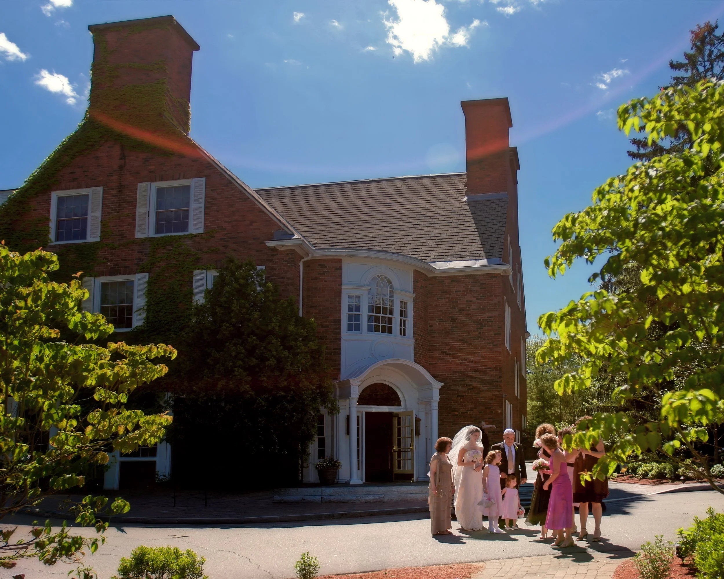 Family Under Inn Facade Ceremony Moment
