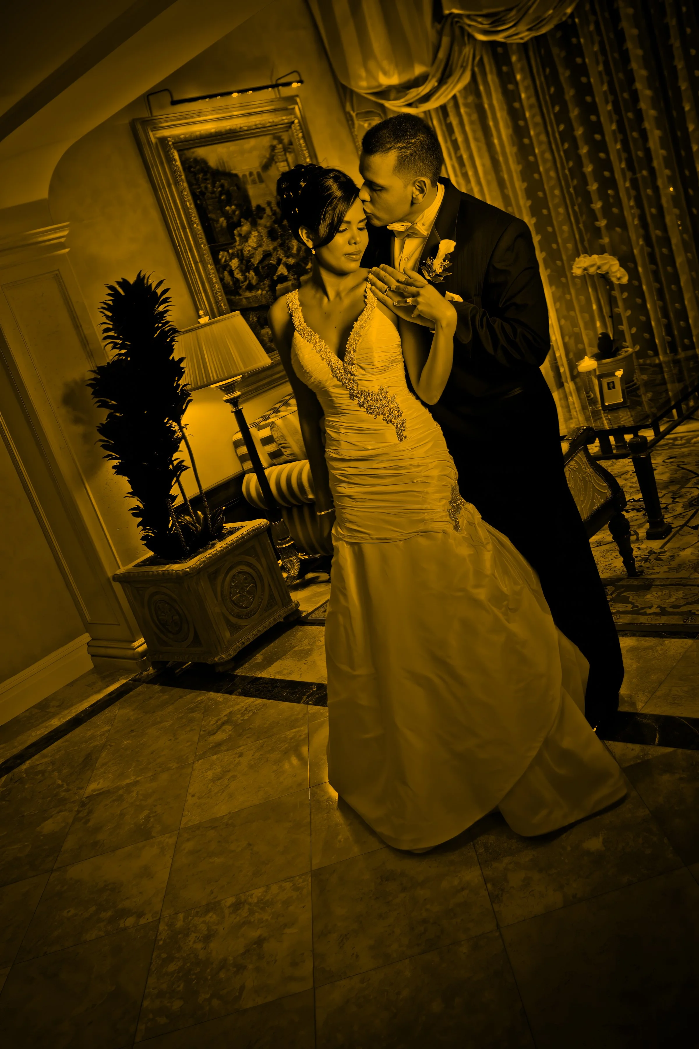 Fine art split-toned portrait of bride and groom in the elegant lobby at Delamar Greenwich Harbor wedding venue.