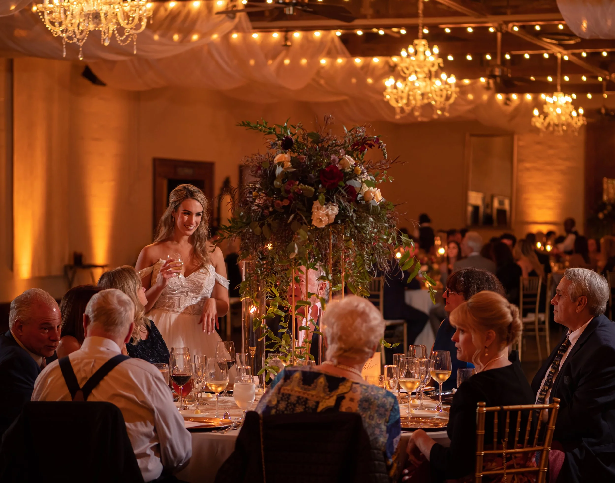 Bride Greeting Guests at Savannah Station Reception Tables