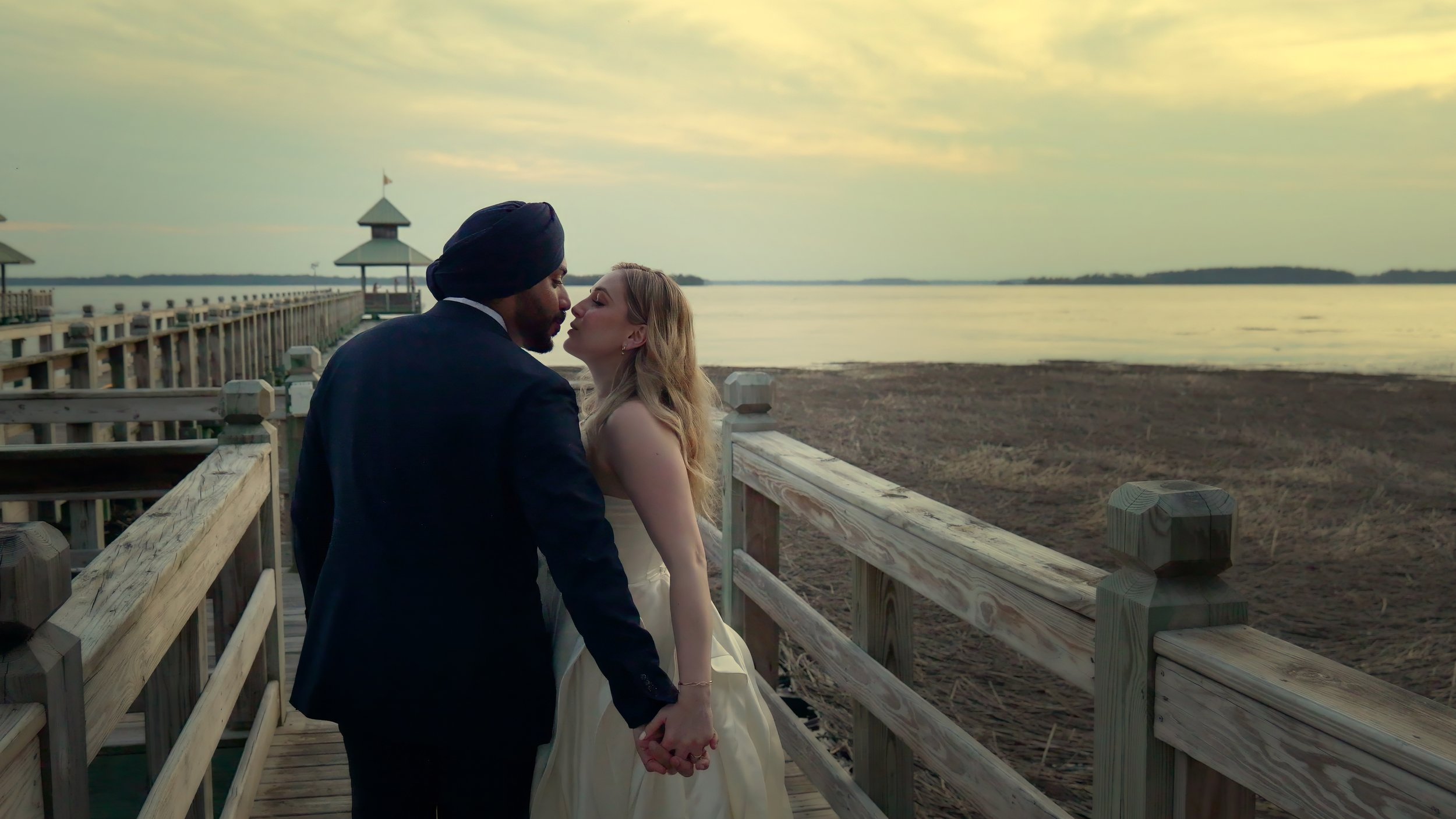 Bride and Groom Kiss on the Dock South Carolina Yacht Club Hilton Head Waterfront