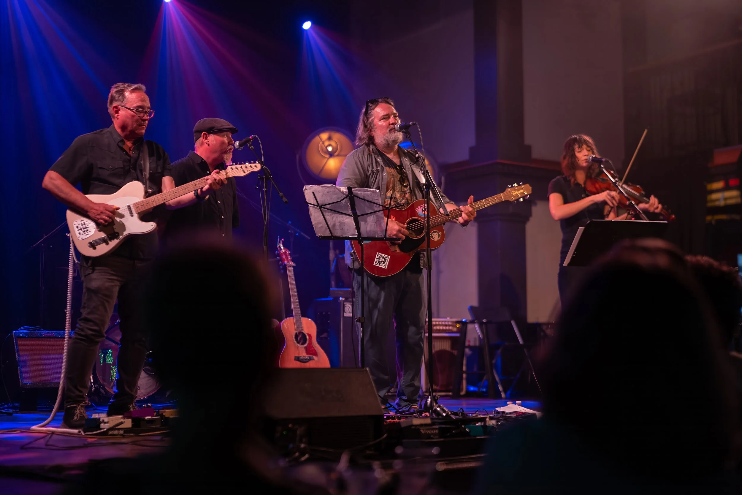 Stage right view of Eric Britt & Family performing at Victory North with audience members watching from the floor during Homegrown Summer Jam 2026.