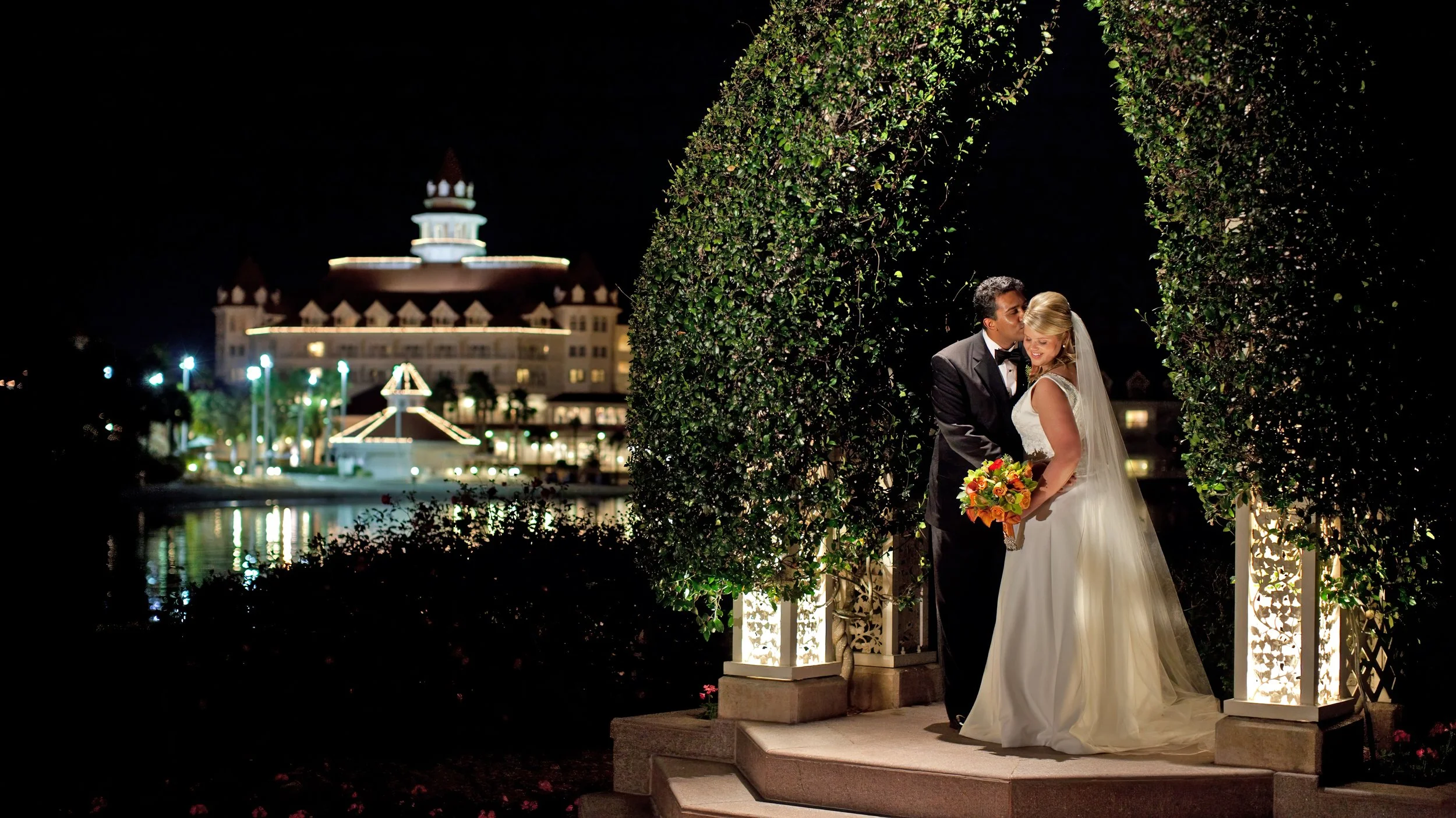 Bride and groom portrait overlooking Disney’s Grand Floridian Resort & Spa during their wedding day.