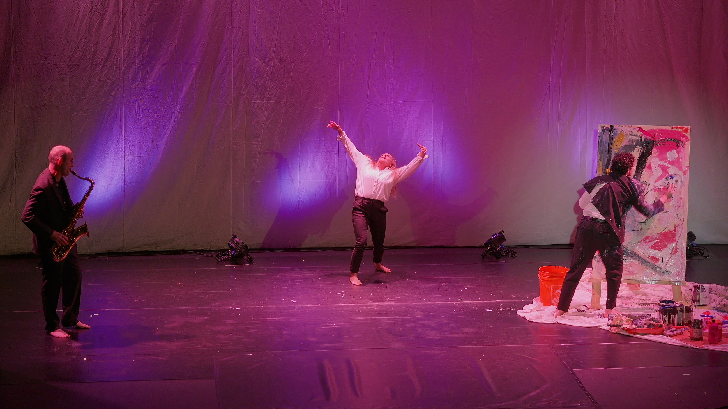 Contemporary dancer performs alongside a saxophonist and live painter during Tybee Ballet Theatre's From the Minds of Others at the Tybee Post Theater.