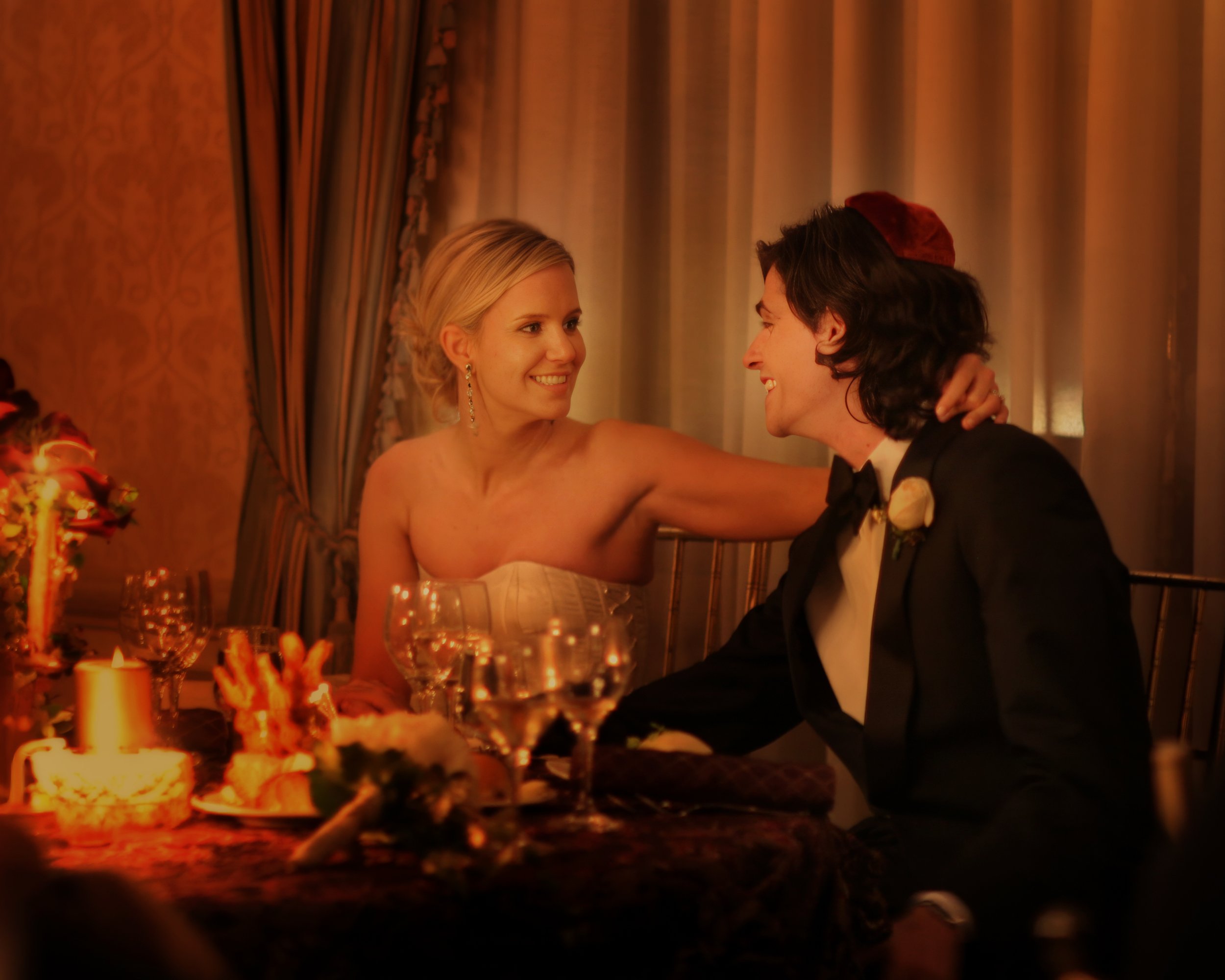 Bride and groom sharing a private moment during dinner at the Harmonie Club in Manhattan