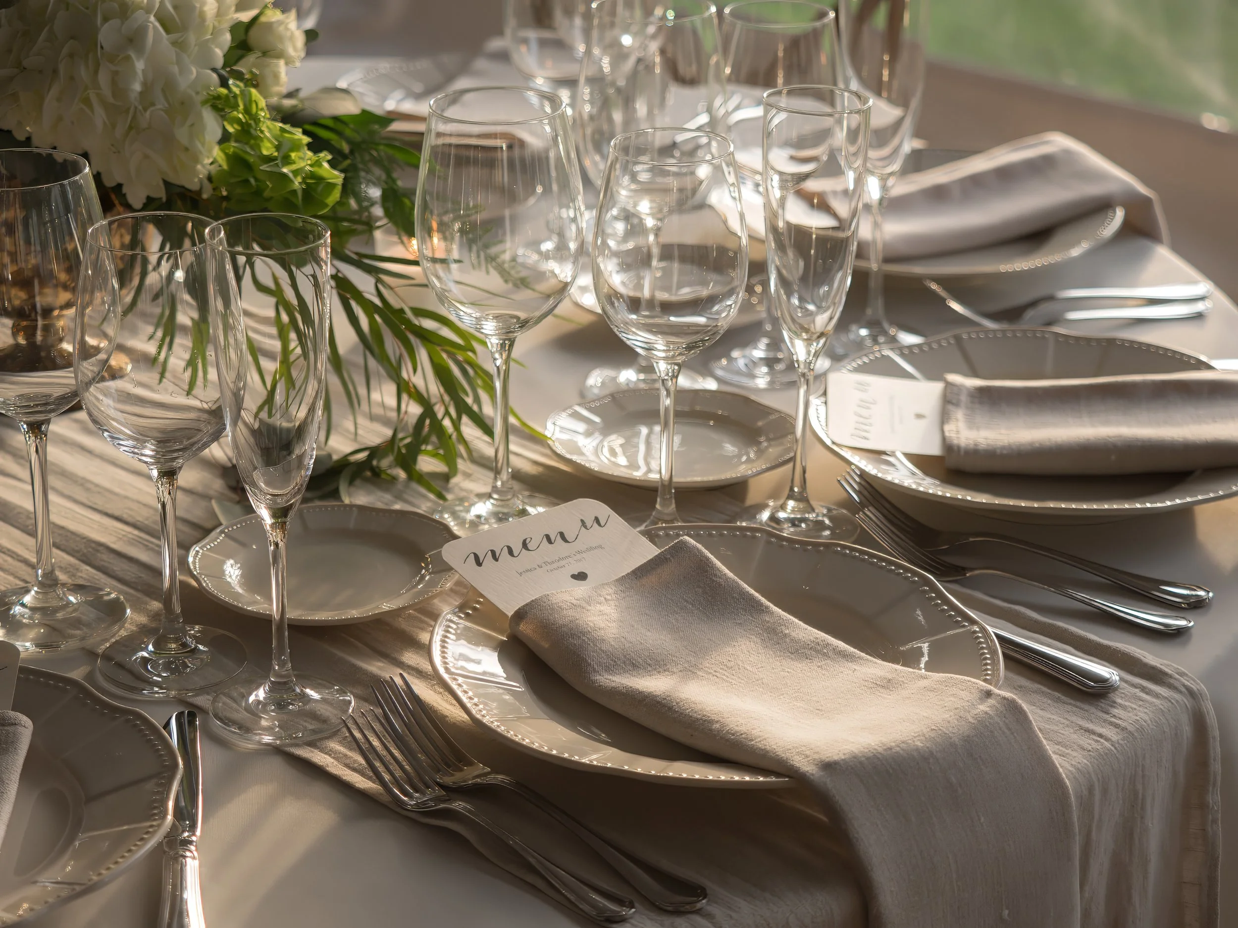 Elegant wedding place setting with table details at Lion Rock Farm reception