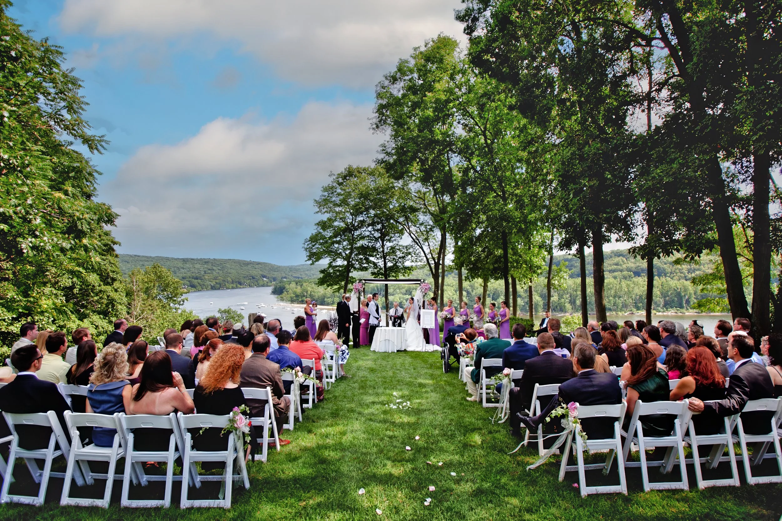 Water front views of a wedding ceremony at Saint Clements Castle in Portland CT