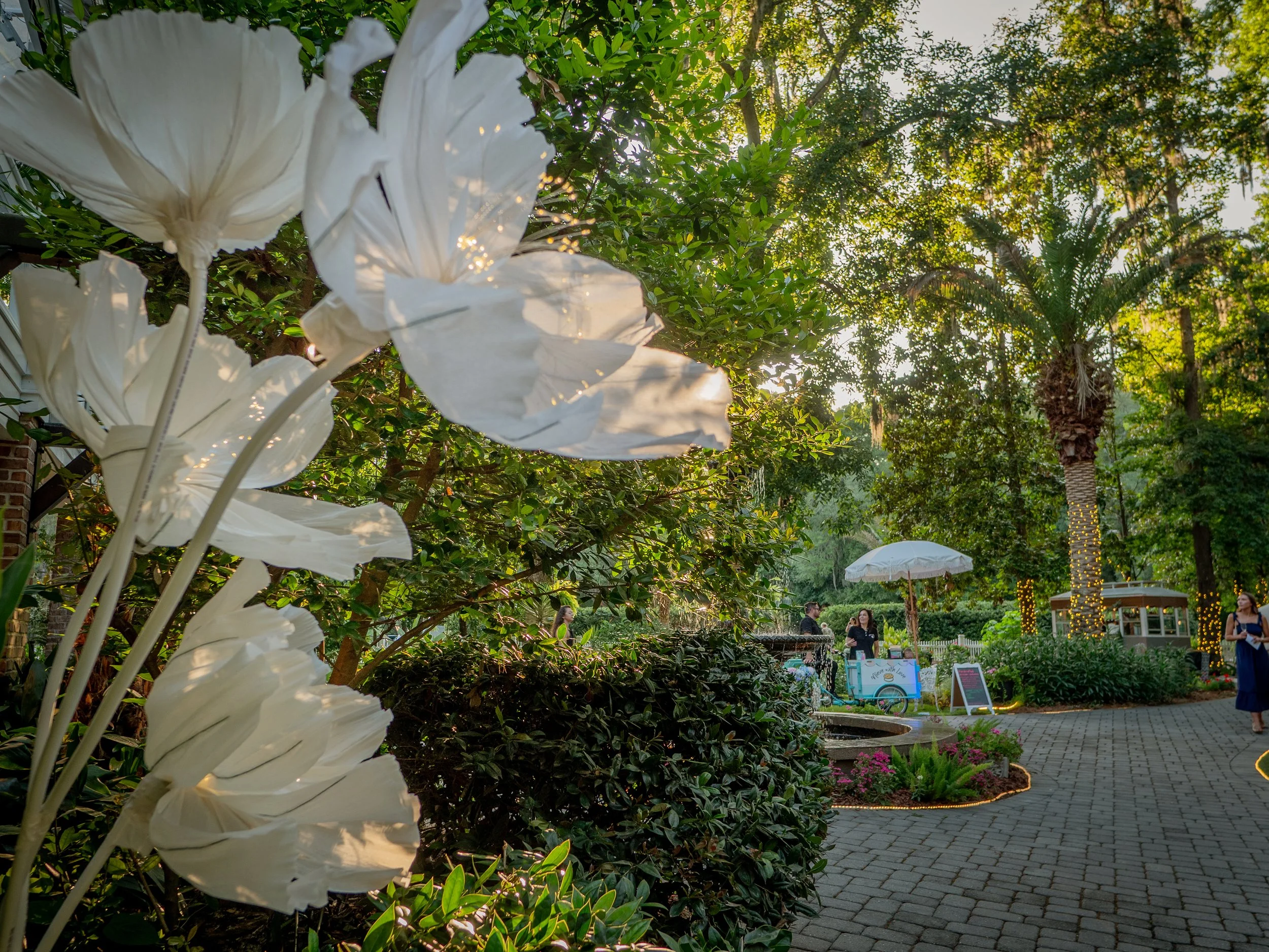 Large decorative paper flowers by The Blooming Wall by Krupa displayed during a corporate event at The Mackey House Savannah.