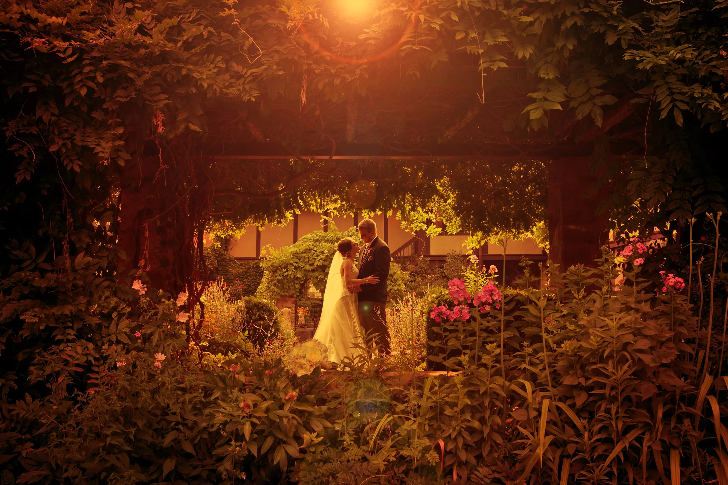 Bride and groom sharing a romantic moment in the courtyard at Saint Clements Castle