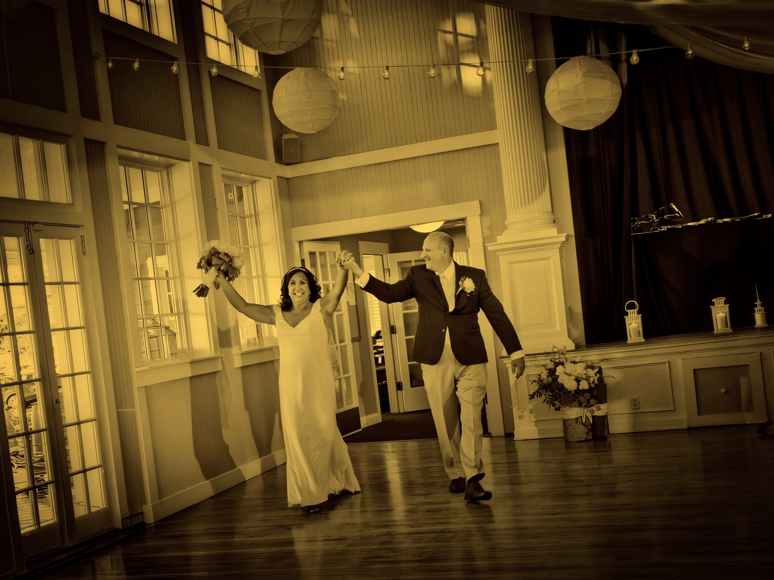 A bride and groom are announced into the clubhouse ballroom at Pine Orchard