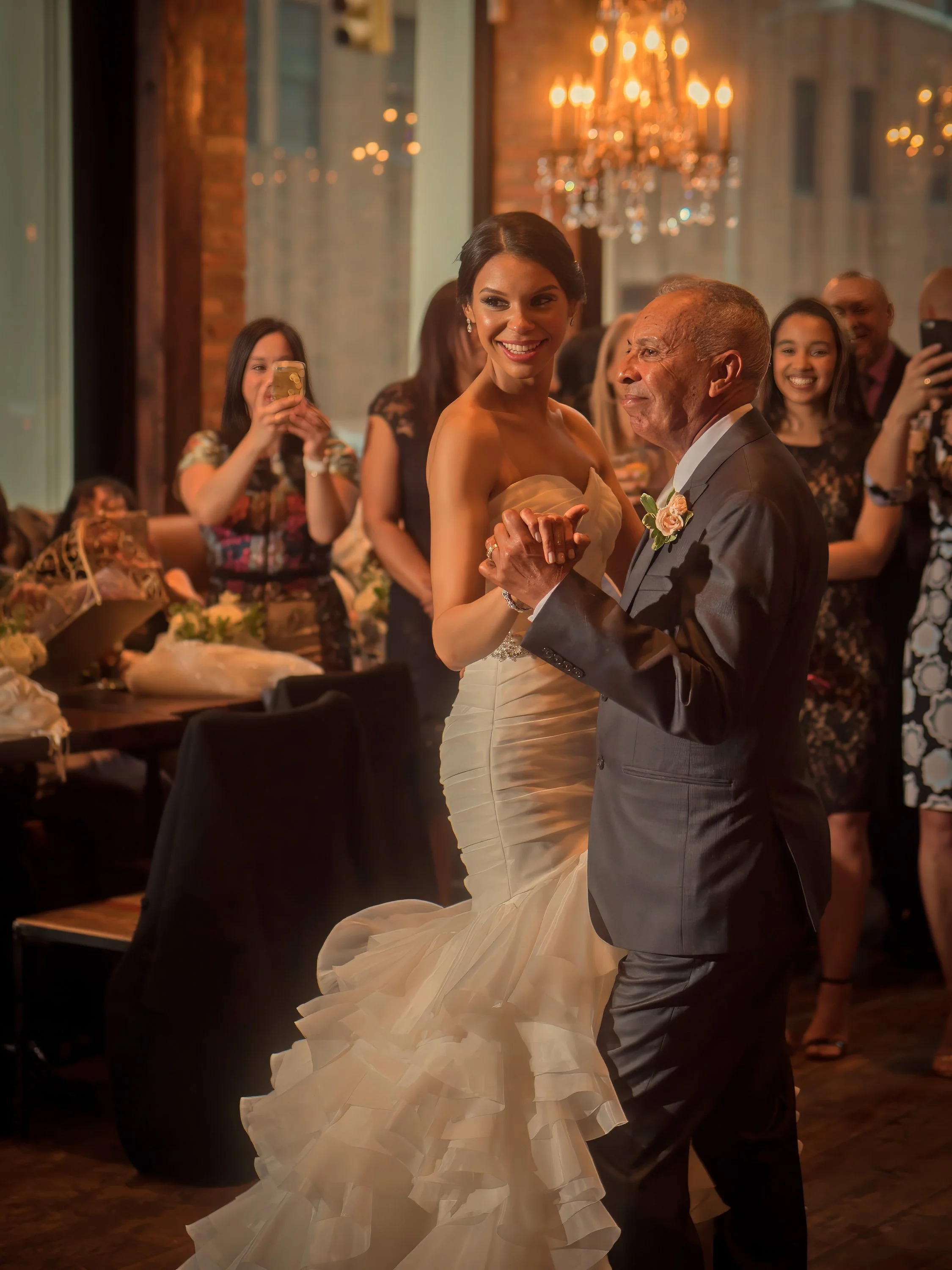Bride shares a father-daughter dance during a New York City wedding reception at Añejo restaurant.