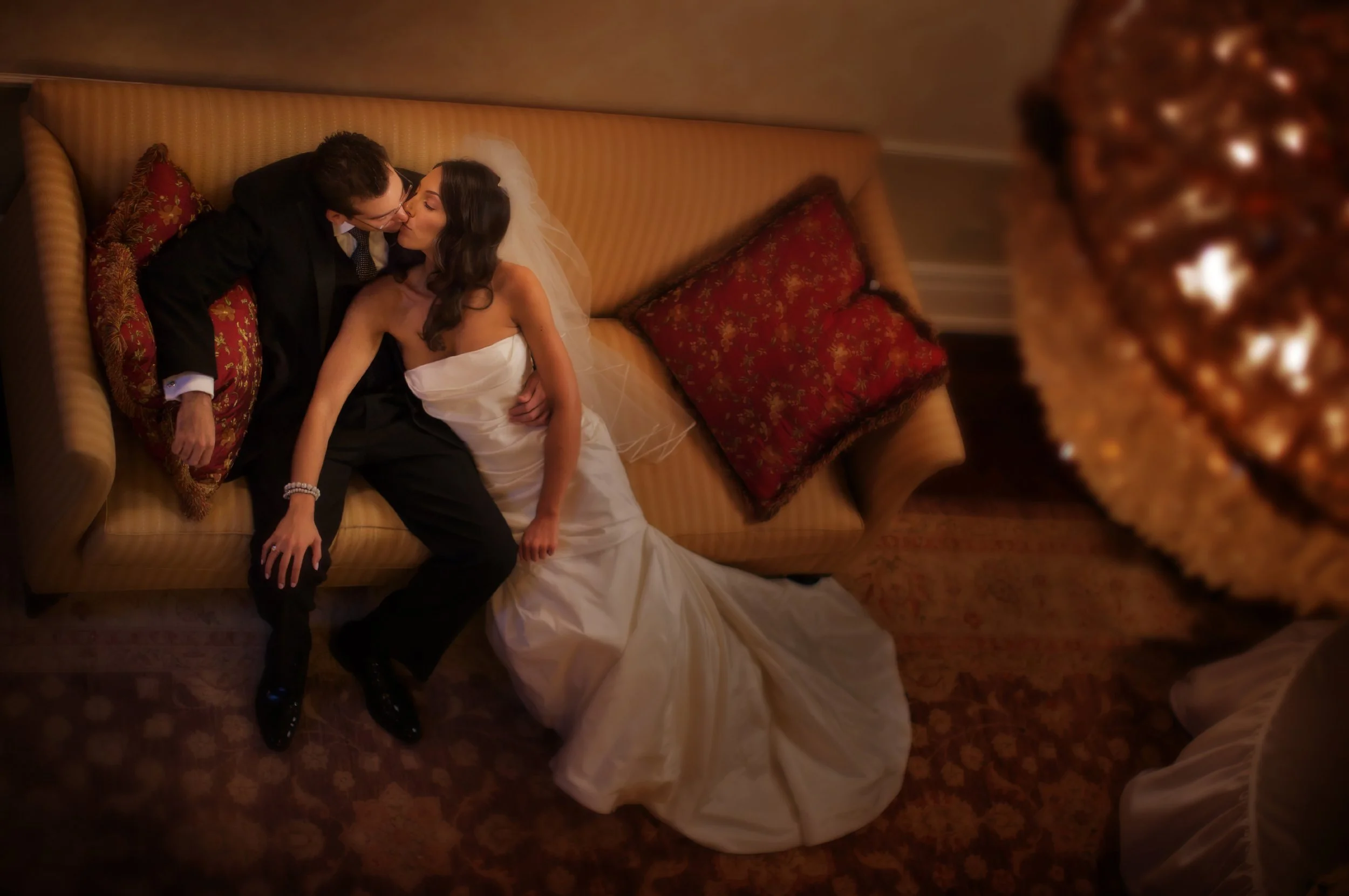 Bride and groom share a tender kiss in the elegant foyer of Preakness Hills Country Club.