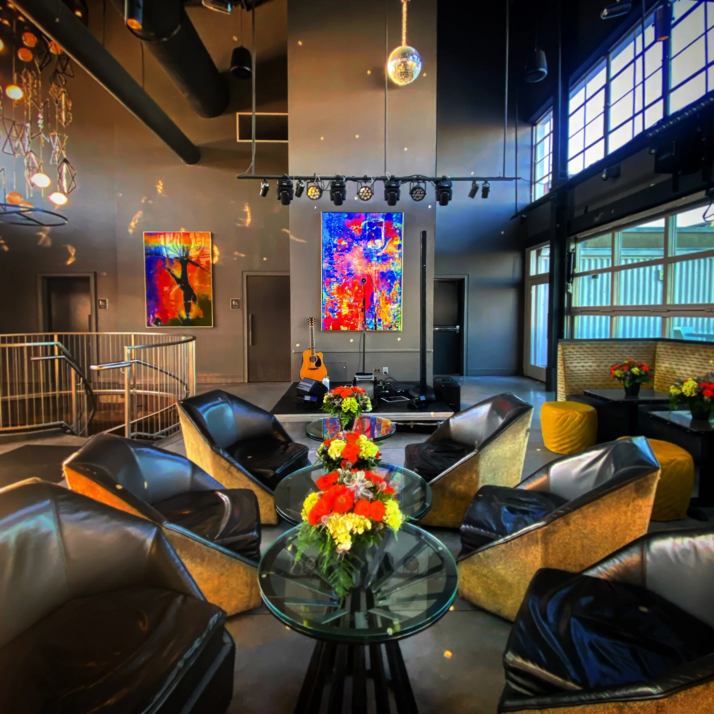 A corporate party setup with live music at Electric Moon rooftop bar in Savannah, overlooking the waterfront at Plant Riverside District.