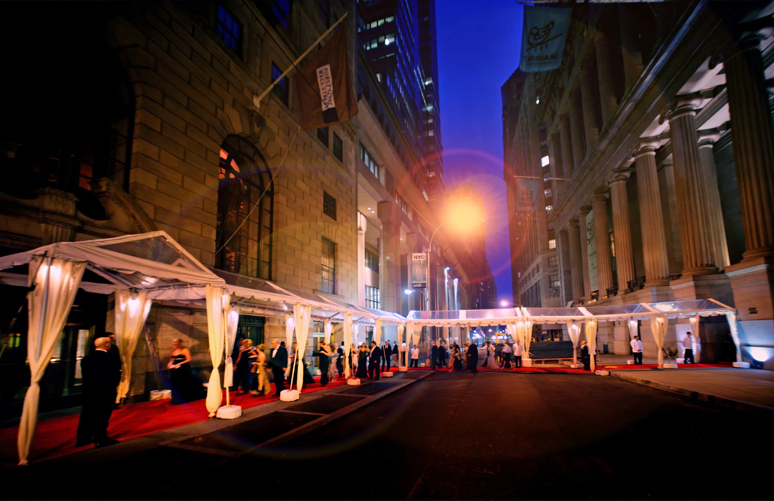Guests walking red carpet from 48 Wall Street wedding ceremony to Cipriani Wall Street reception in Manhattan.