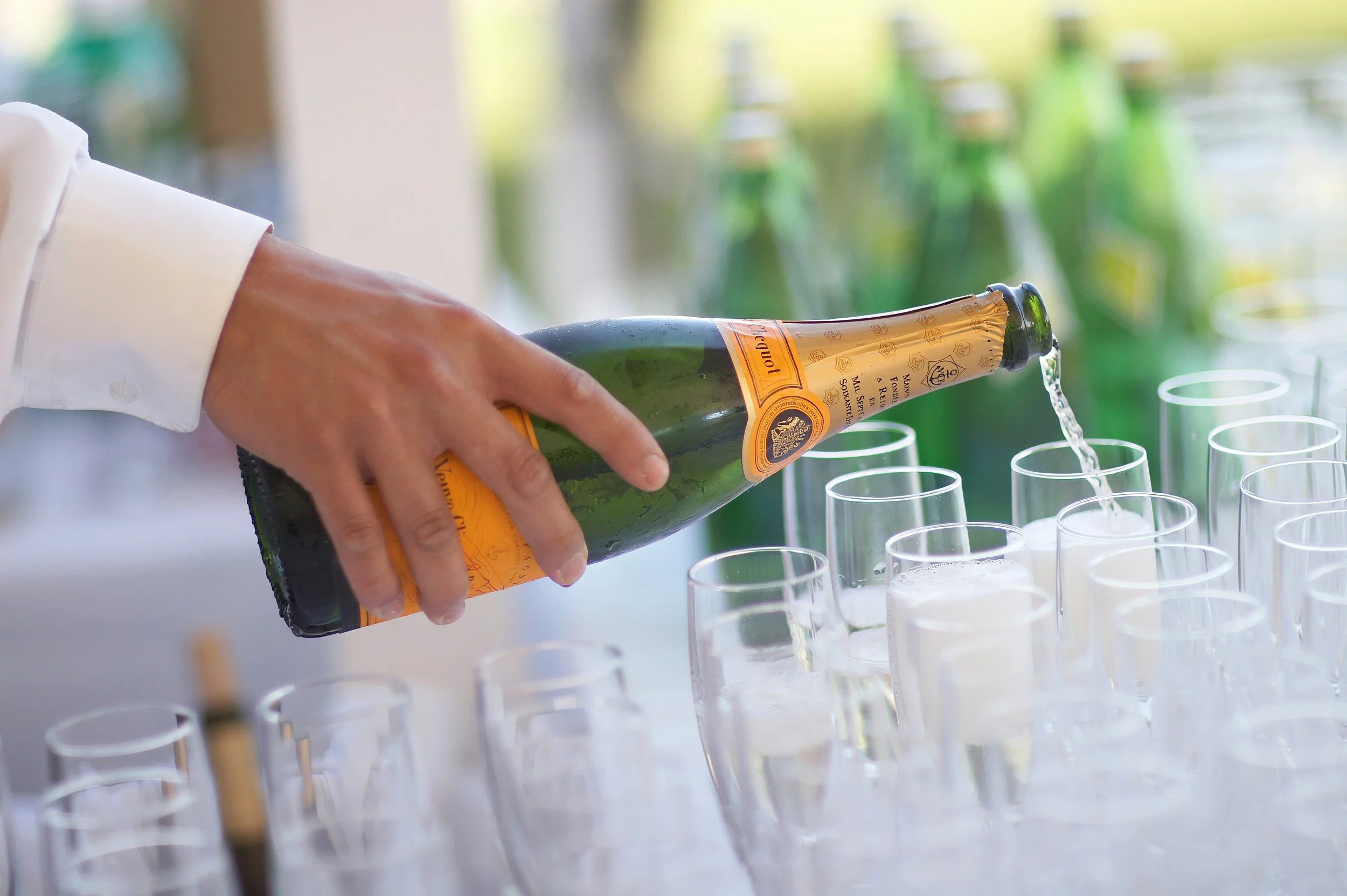 Champagne being poured during a Belle Haven Yacht Club wedding reception.