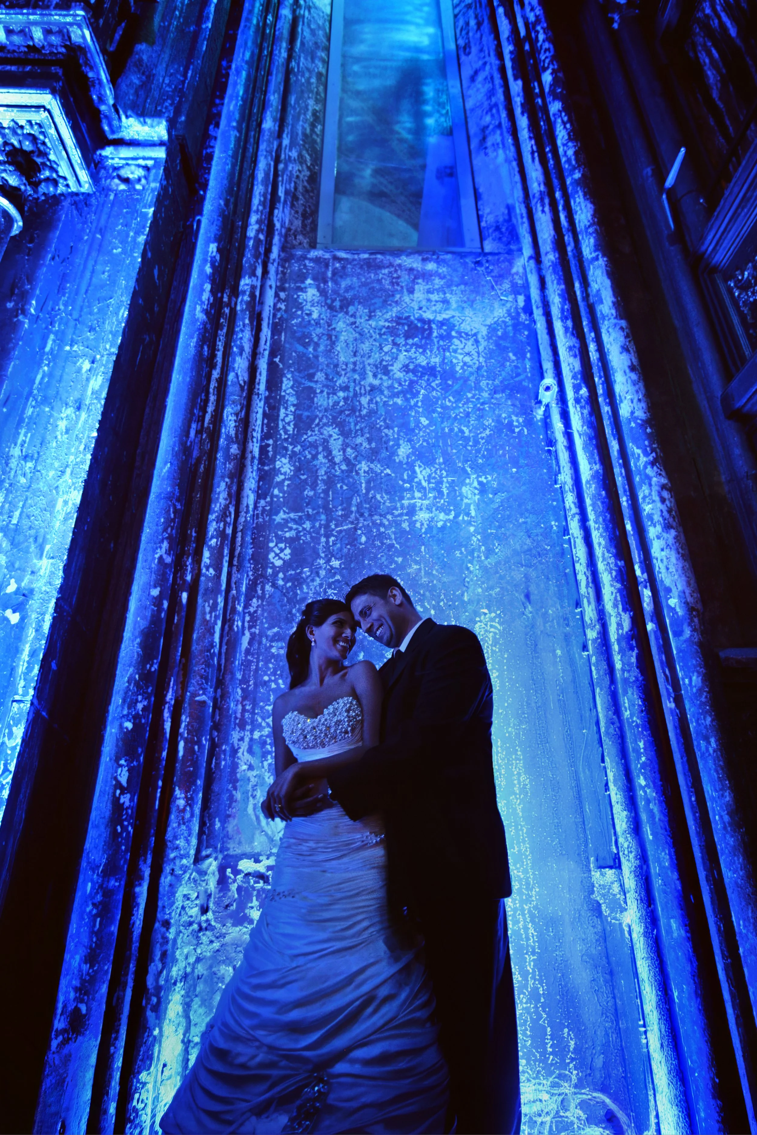 Colorful portrait of the bride and groom inside Angel Orensanz in Manhattan.