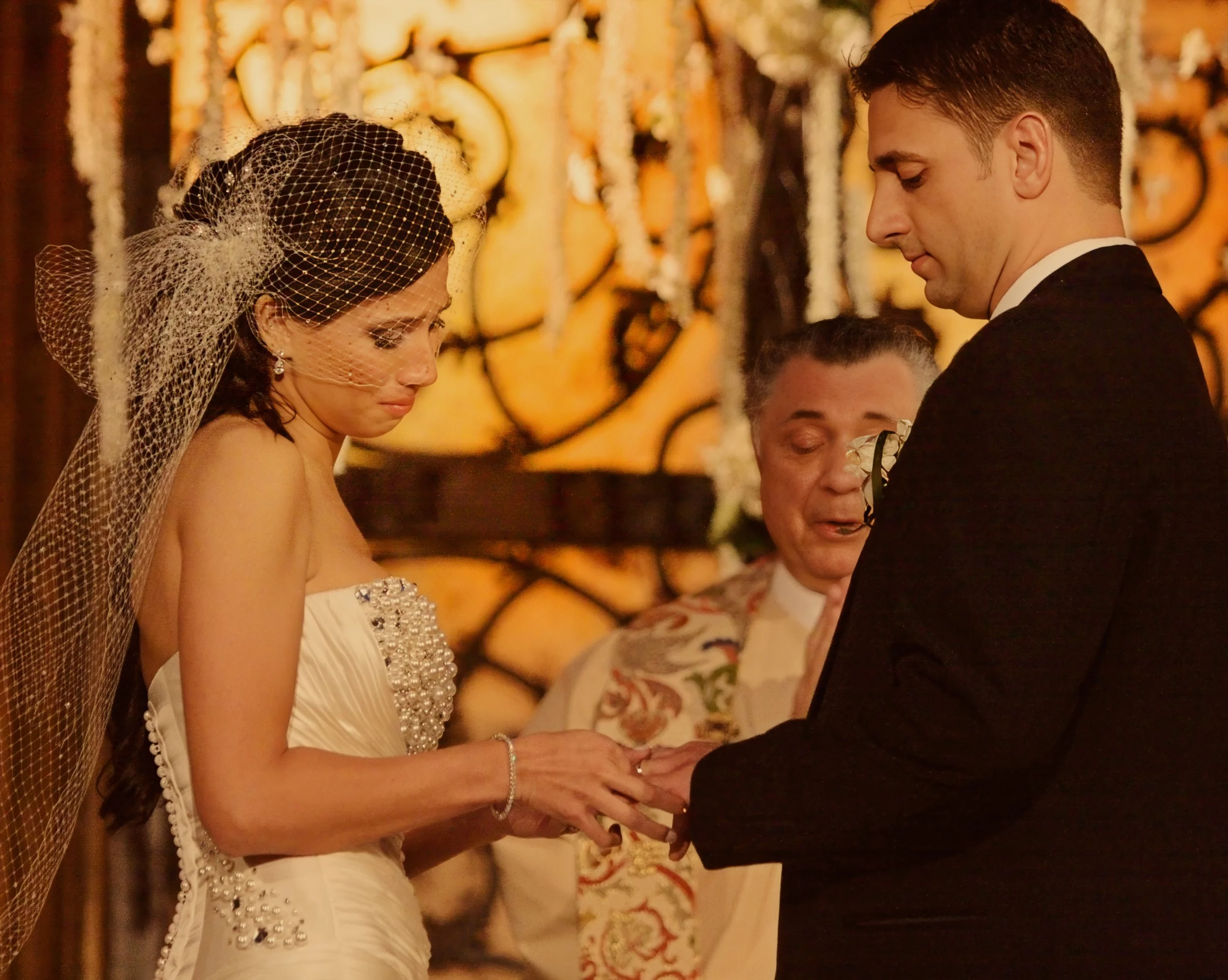 Emotional ring exchange during a wedding ceremony at Angel Orensanz in New York City.