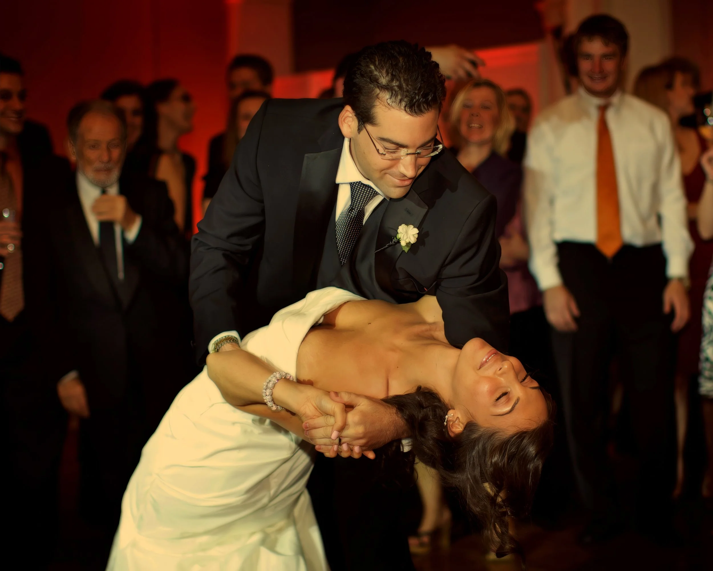 Groom dips bride gracefully during the first dance at Preakness Hills Country Club.