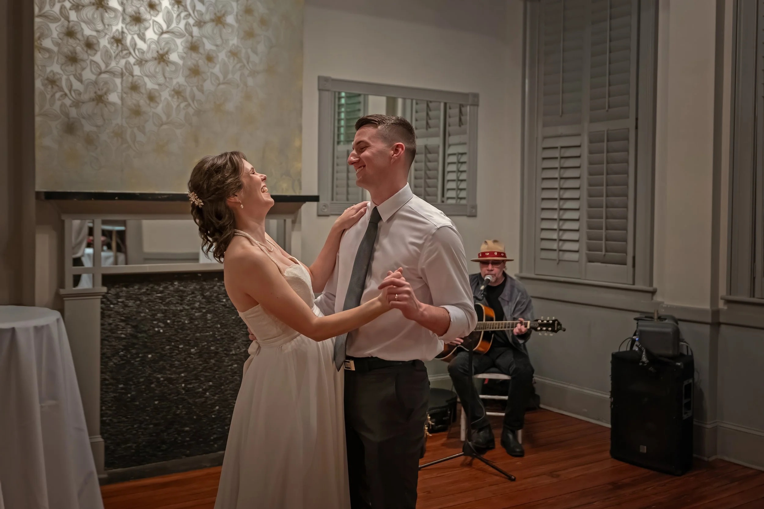Tim and Daniella share their first dance at Churchill’s as Savannah musician Ray Lundy performs during their micro wedding reception.