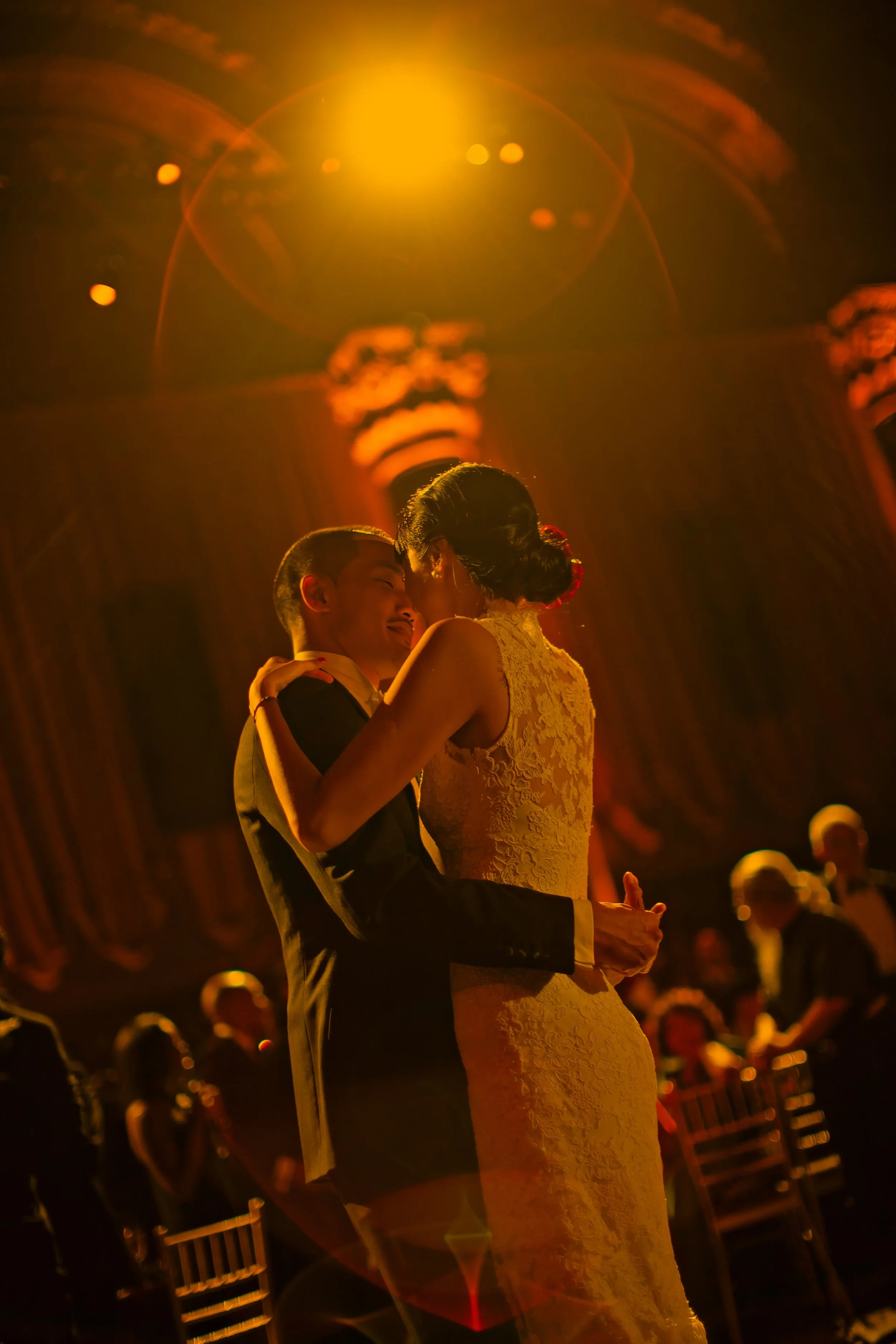 Bride and groom share a romantic moment on the dance floor with dramatic lighting at Cipriani 42nd Street NYC.